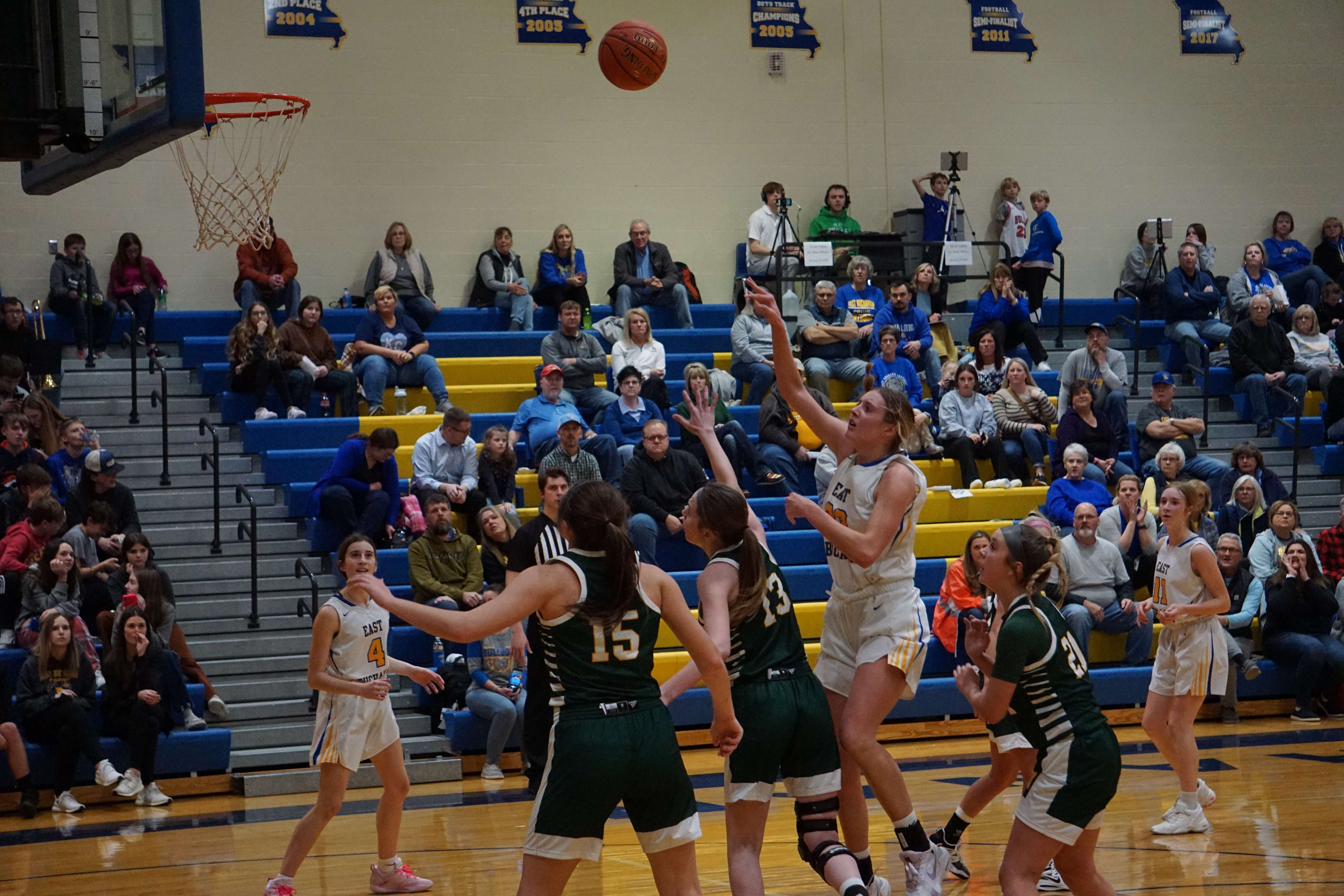 Gracie Kelsey shoots a floater over two Maryville defenders/ Photo by Matt Pike