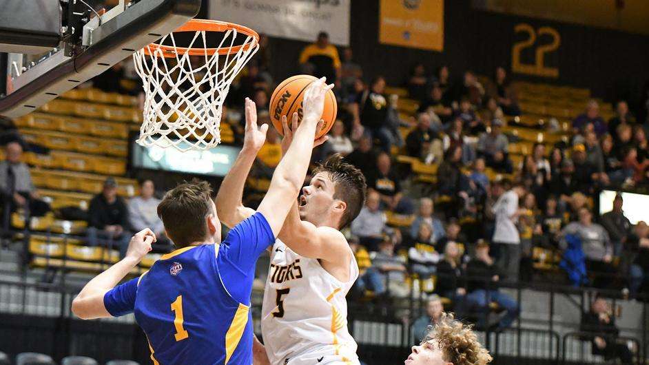 Kaleb Hammeke drives in for a layup against Nebraska-Kearney Saturday at Gross Memorial Coliseum. (FHSU Athletics photo/Nicole Heitmann)