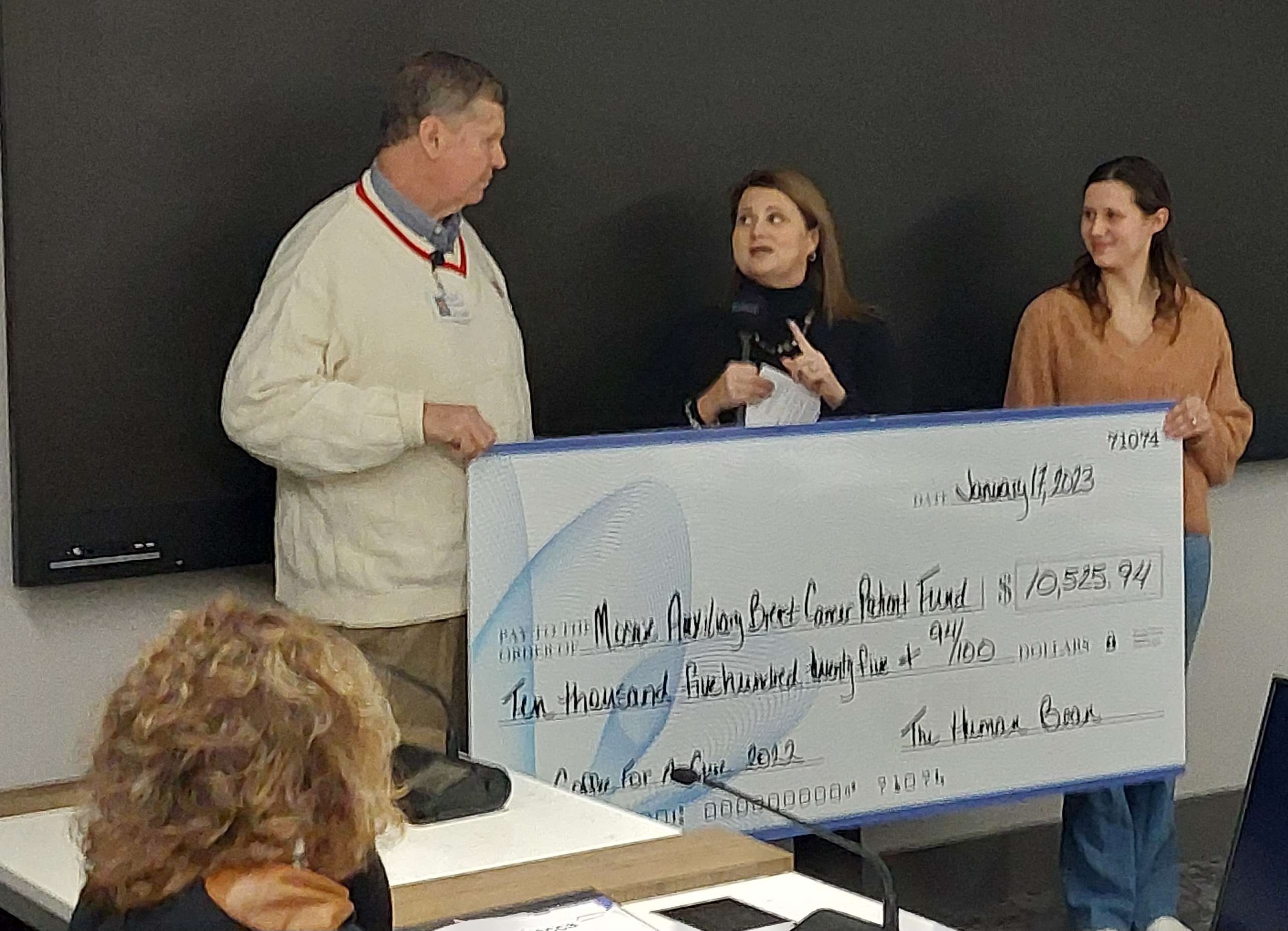 Morgan Spencer (right) from The Human Bean presents a check to President of the Mosaic Life Care Auxiliary Rocky Massin (left) for funds raised from Coffee for a Cure/ Photo by Matt Pike