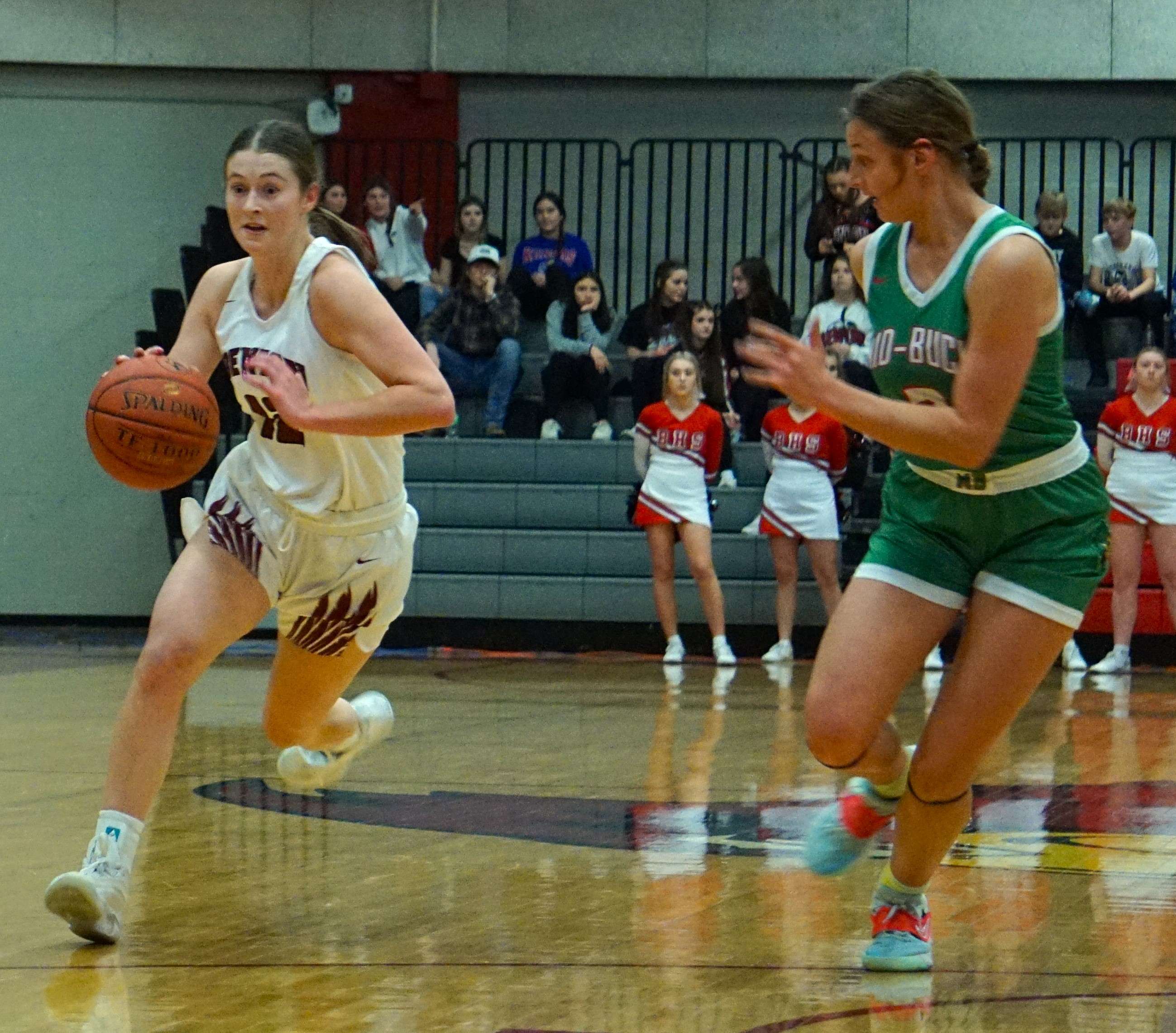 Peyton Anderson (left) dribbles up the floor during Benton's 61-14 win over Mid-Buchanan Tuesday. Photo by Tommy Rezac.