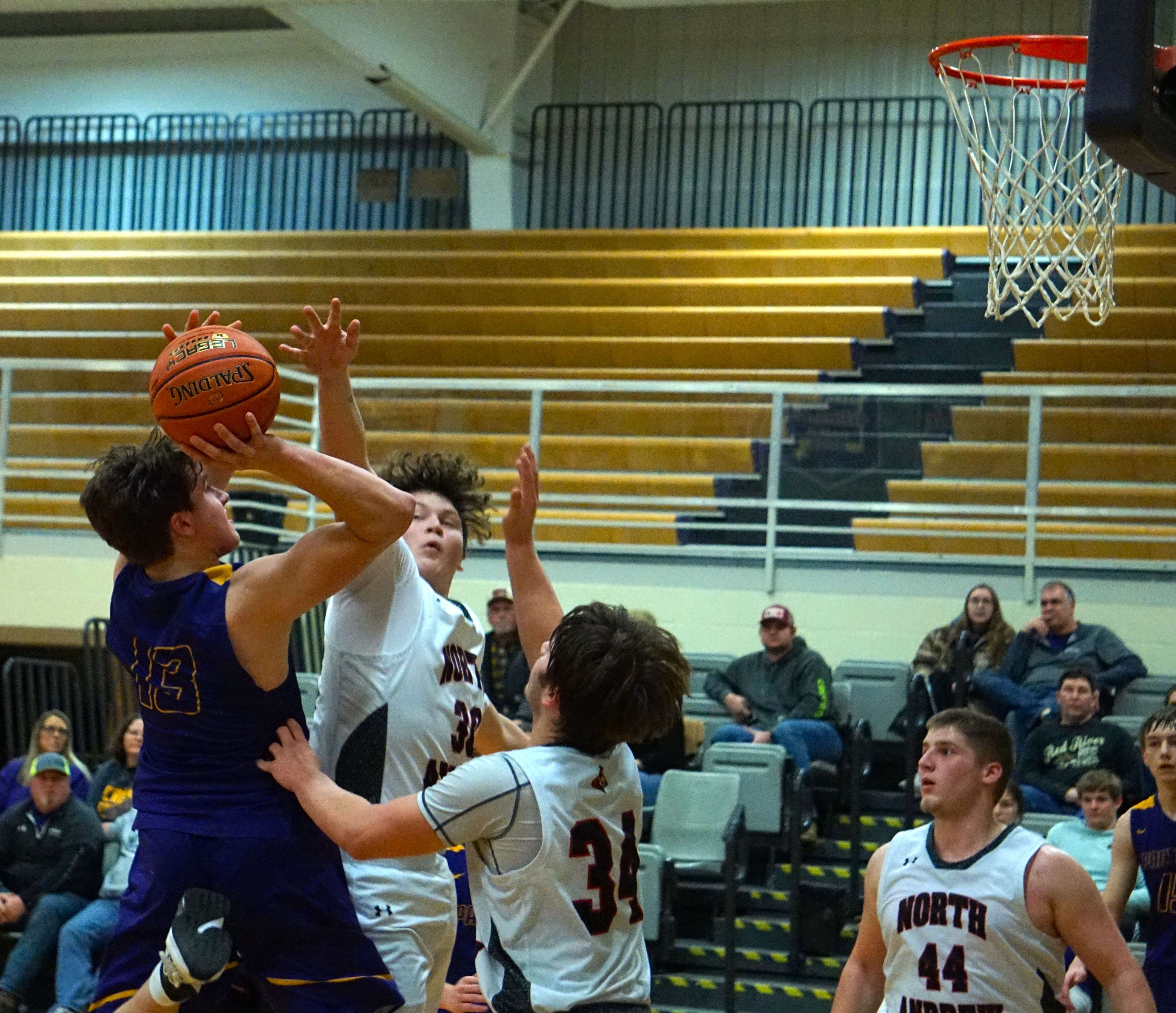 Trevor Tubbs (13) tries to get a shot off in traffic.