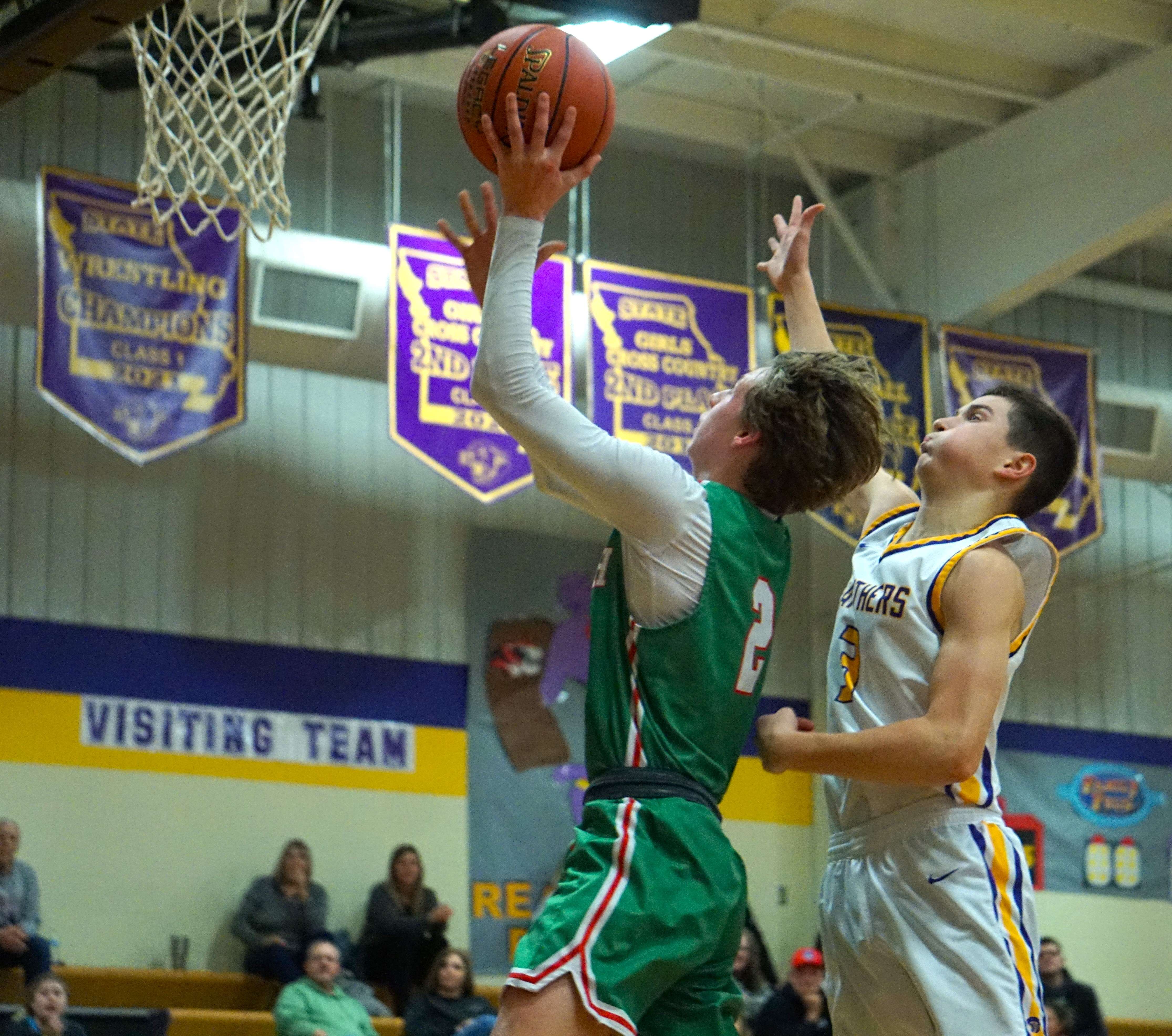 Raife Smith (left) goes up for a layup in the second half of Mid-Buchanan's 44-42 win over North Platte Tuesday. Photo by Tommy Rezac.