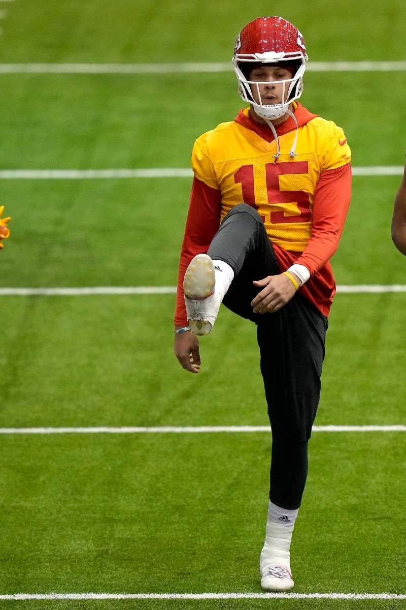 <b>Kansas City Chiefs quarterback Patrick Mahomes stretches runs during a workout Thursday in Kansas City, Mo. The Chiefs are scheduled to play the Cincinnati Bengals Sunday in the AFC championship game.</b> (AP Photo/Charlie Riedel)