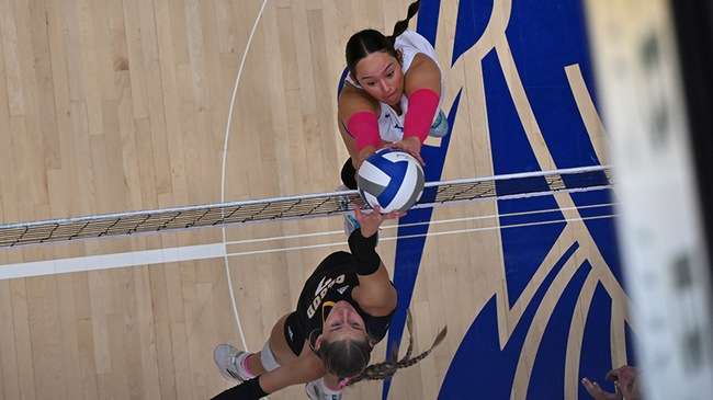 Setter Giovanna Ravanhani wins a joust at the net in the second set of the Blue Dragon volleyball team's 3-0 KJCCC victory over Cloud County on Saturday at the Sports Arena. (Andrew Carpenter/Blue Dragon Sports Information)