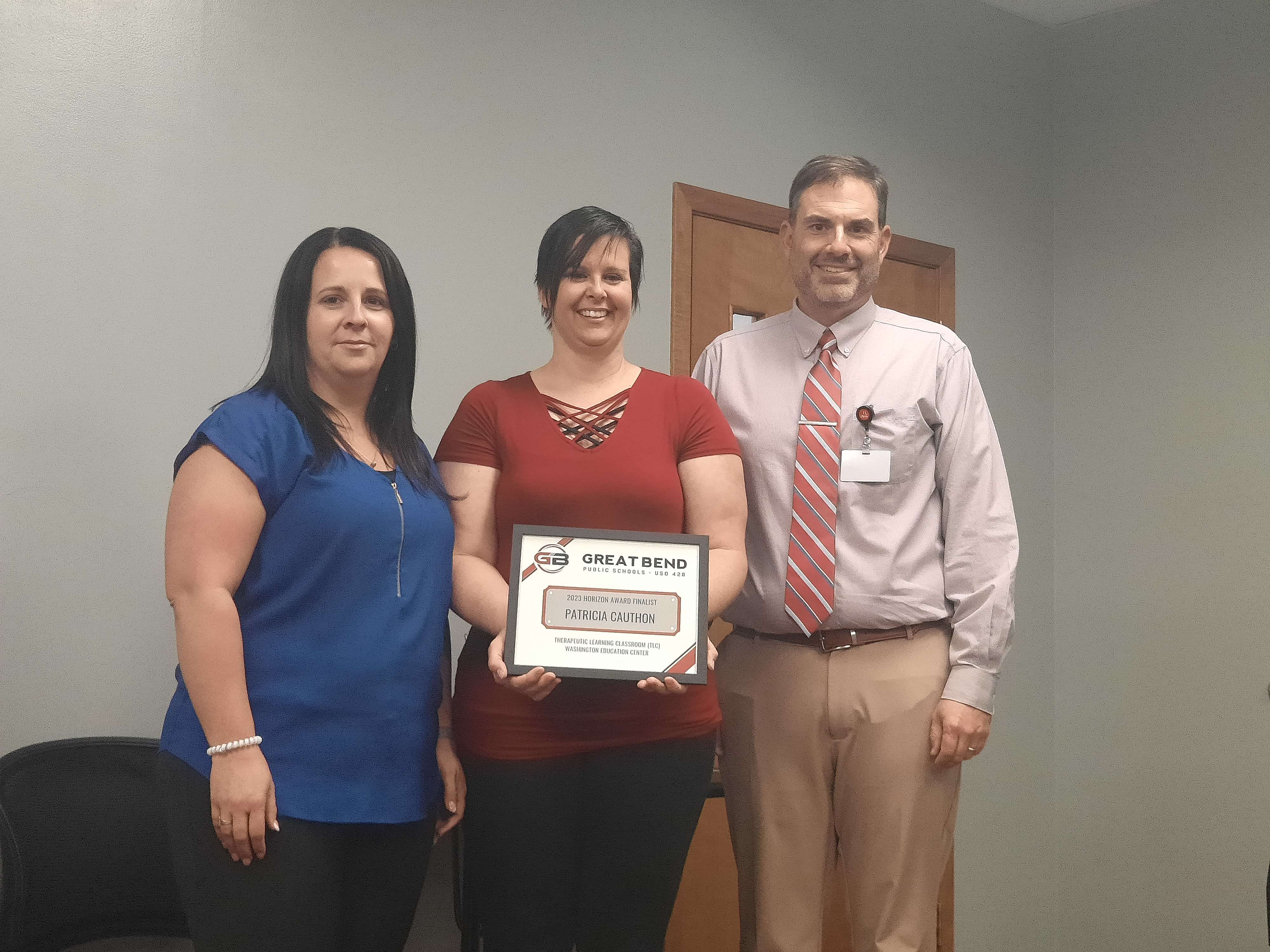USD 428 Director of Special Education Ashley Riley (left) nominated second-year teacher Patricia Cauthon for the Horizon Award. Riley and Superintendent Khris Thexton recognized Cauthon during Monday's board of education meeting.