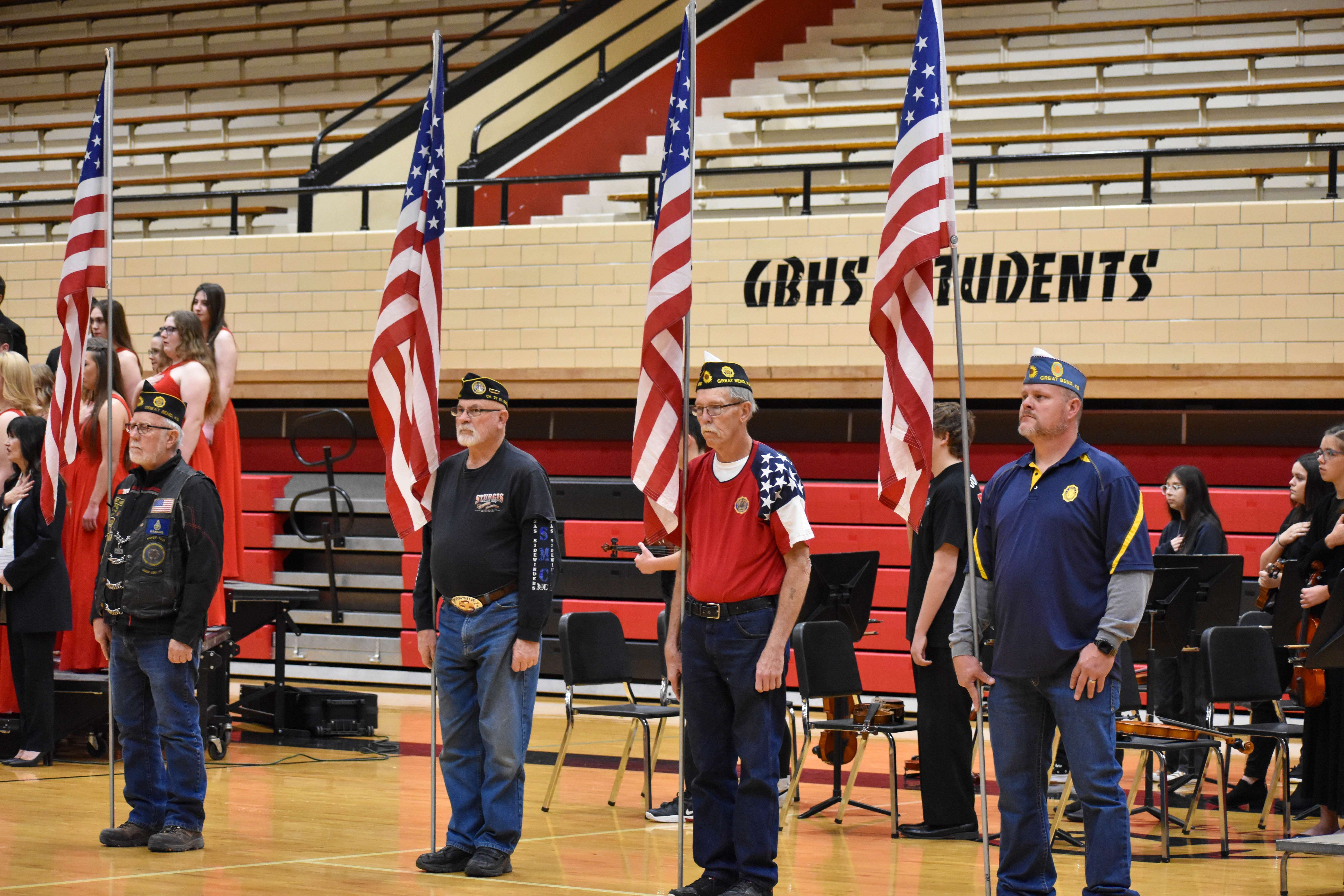 Members from the Great Bend American Legion, Post 180, present the flags at the 2022 GBHS Veteran's Day Assembly.
