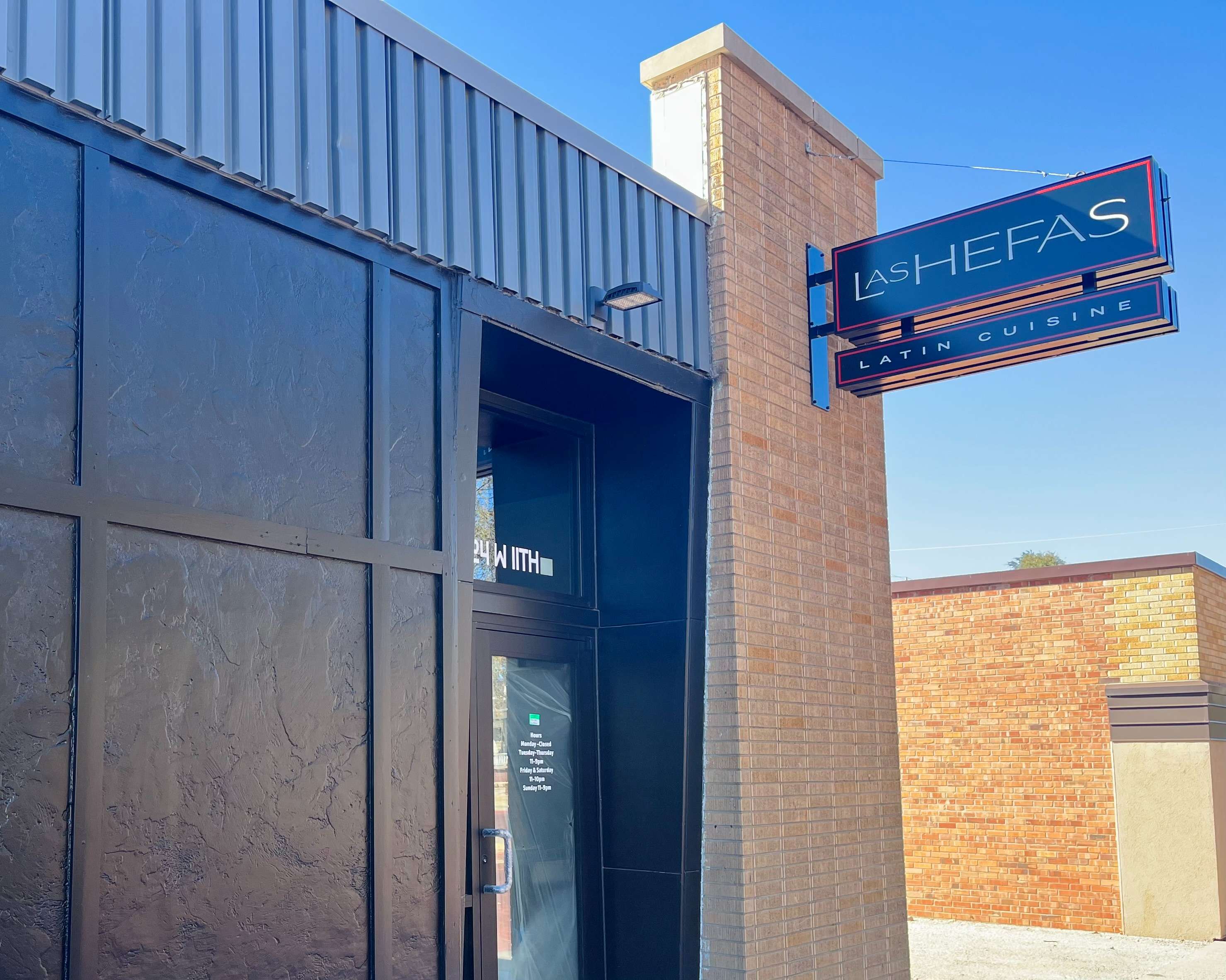 Las Hefas Latin Cuisine sign outside of its restaurant building. Photo By Tony Guerrero/Hays Post