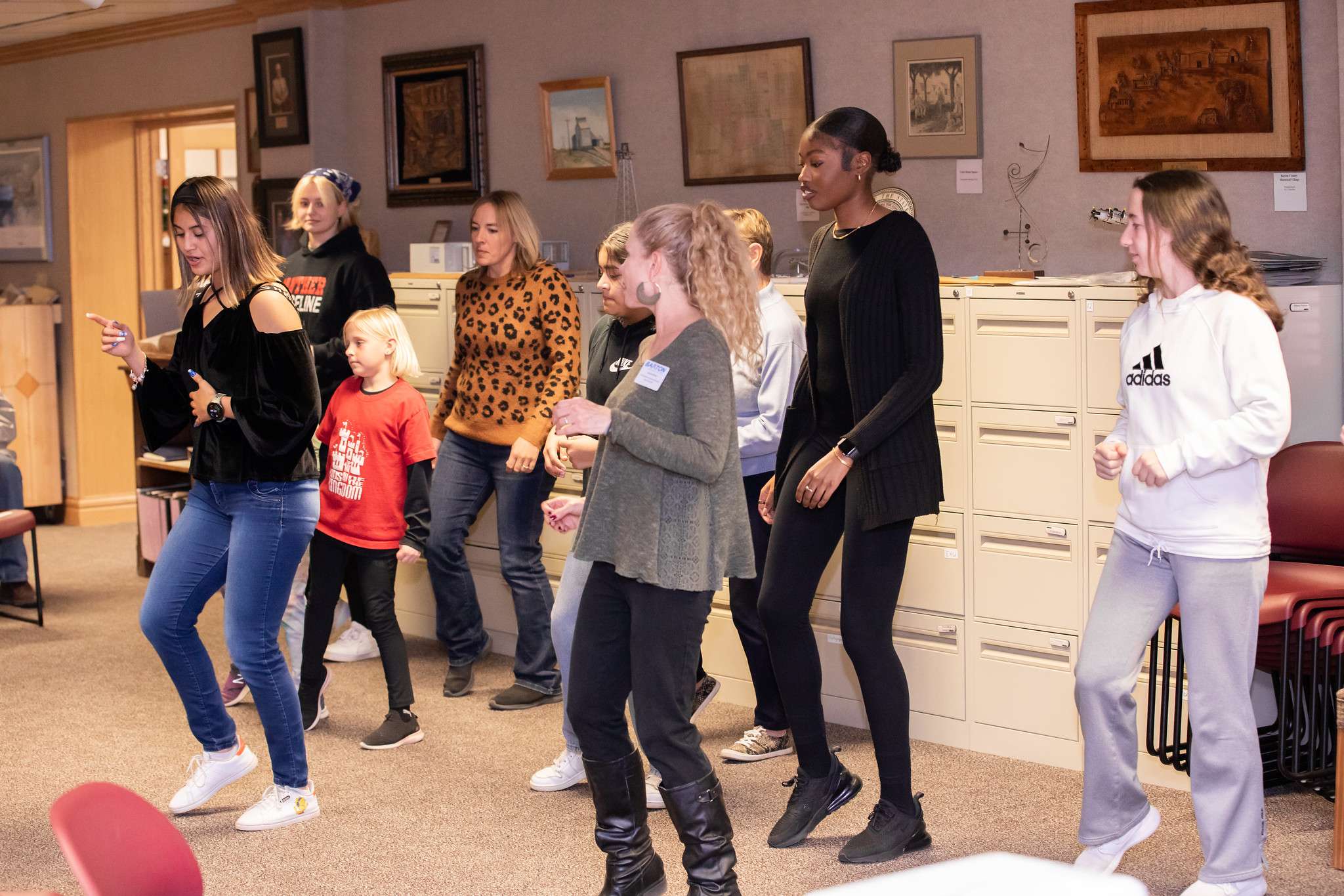 A Barton History of Dance class student instructs other students and community members on how to do the Latin dance, “The Bachata” at last year’s “Dancing Around the World” event.
