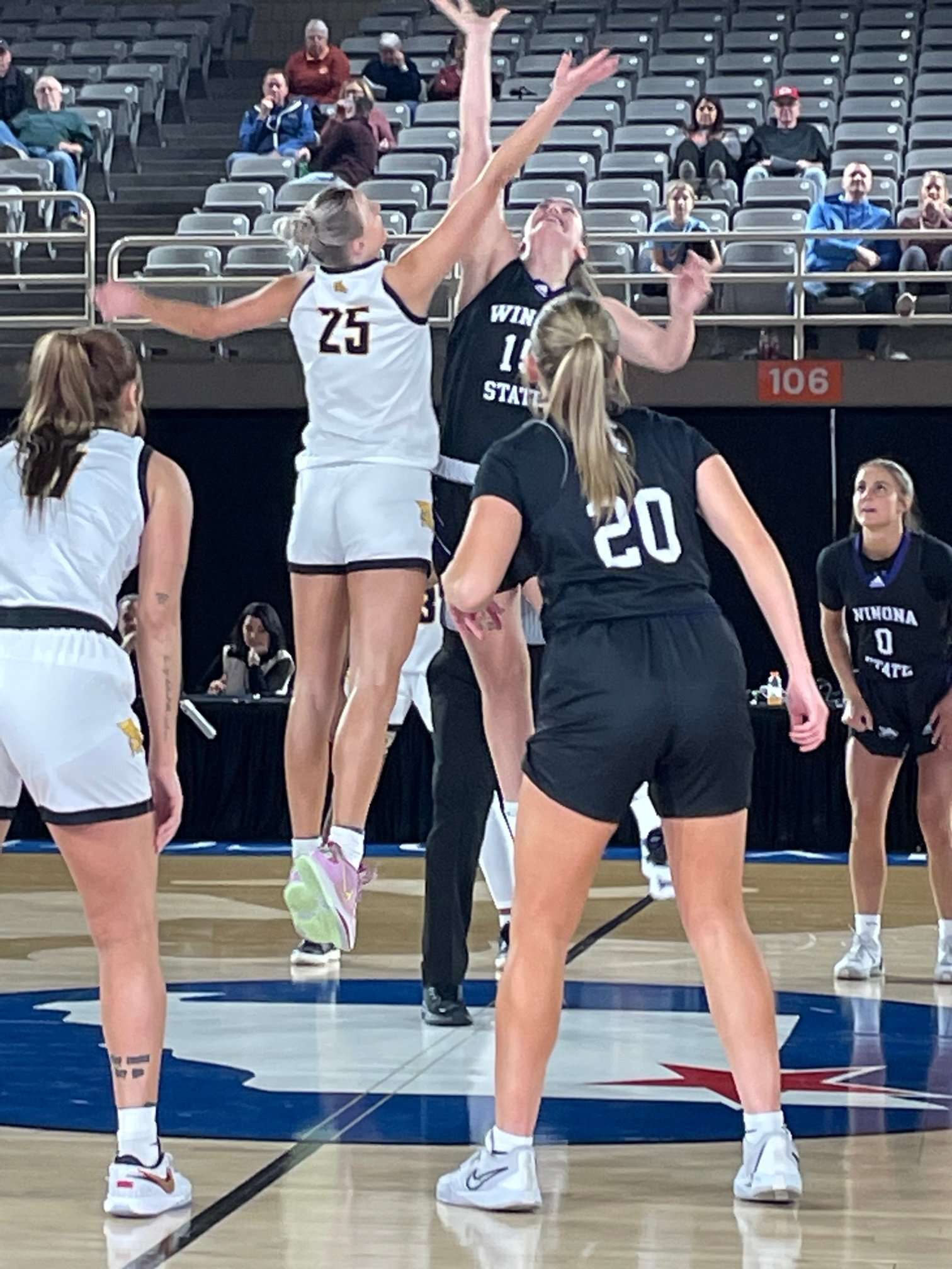 Mary Fultz (25) jumps at midcourt at the start of Friday's game. Photo via the St. Joseph Sports Commission.