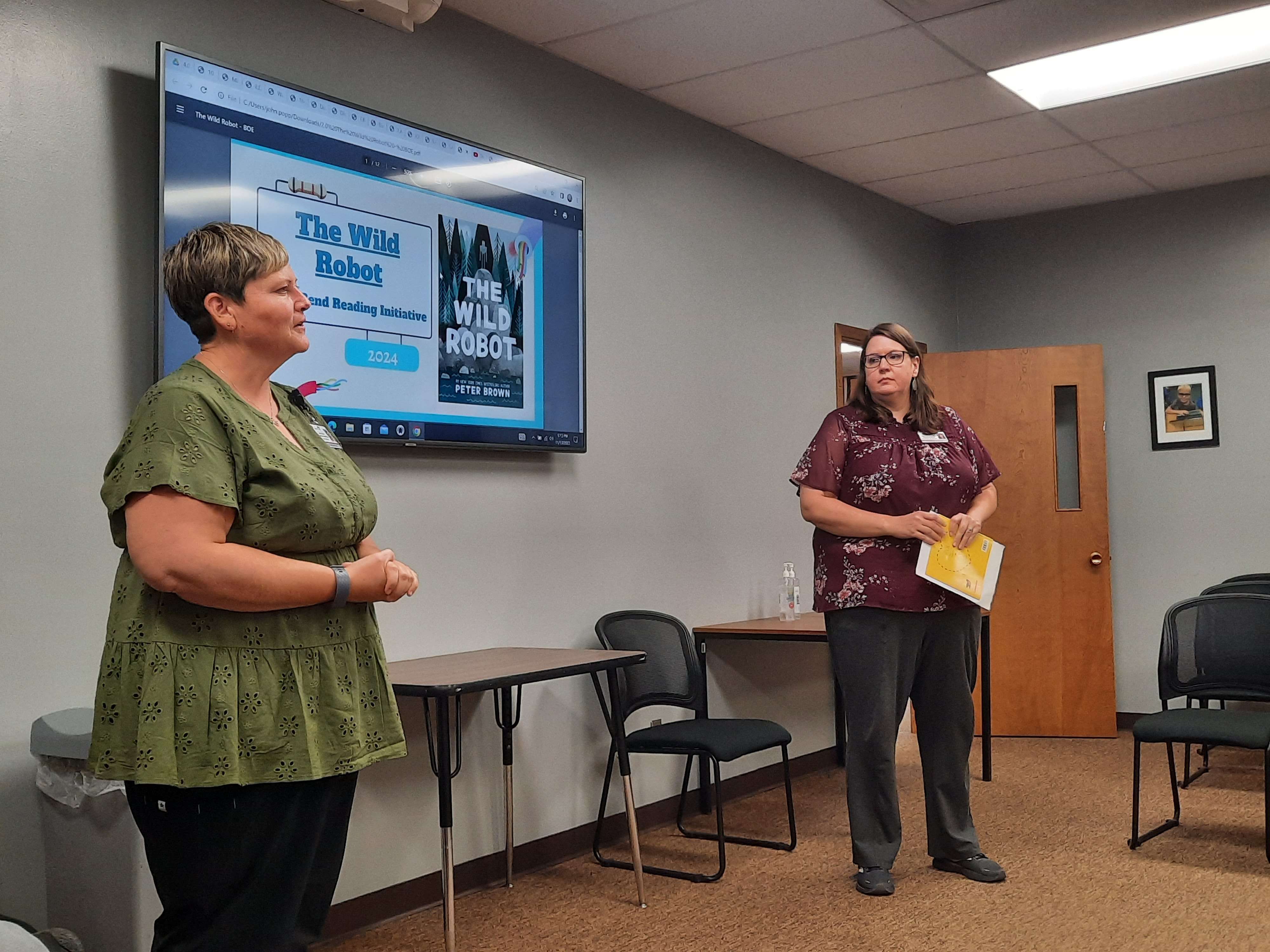 USD 428 Media Specialist Holly Tittel (left) and Eisenhower and Little Panther Preschool Librarian Kristine Boepple presented the 2024 GB Reads Initiative book to the USD 428 Board of Education Monday evening.