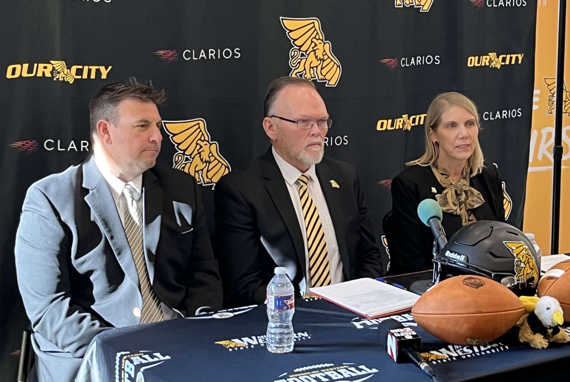 Missouri Western head coach Tyler Fenwick (left), Missouri Western athletic director Andy Carter (center) and University president Elizabeth Kennedy (right) listen in on a conference call Wednesday as the Griffon football team was officially selected to play in the Live United Bowl on Dec. 2. Photo by Tommy Rezac.