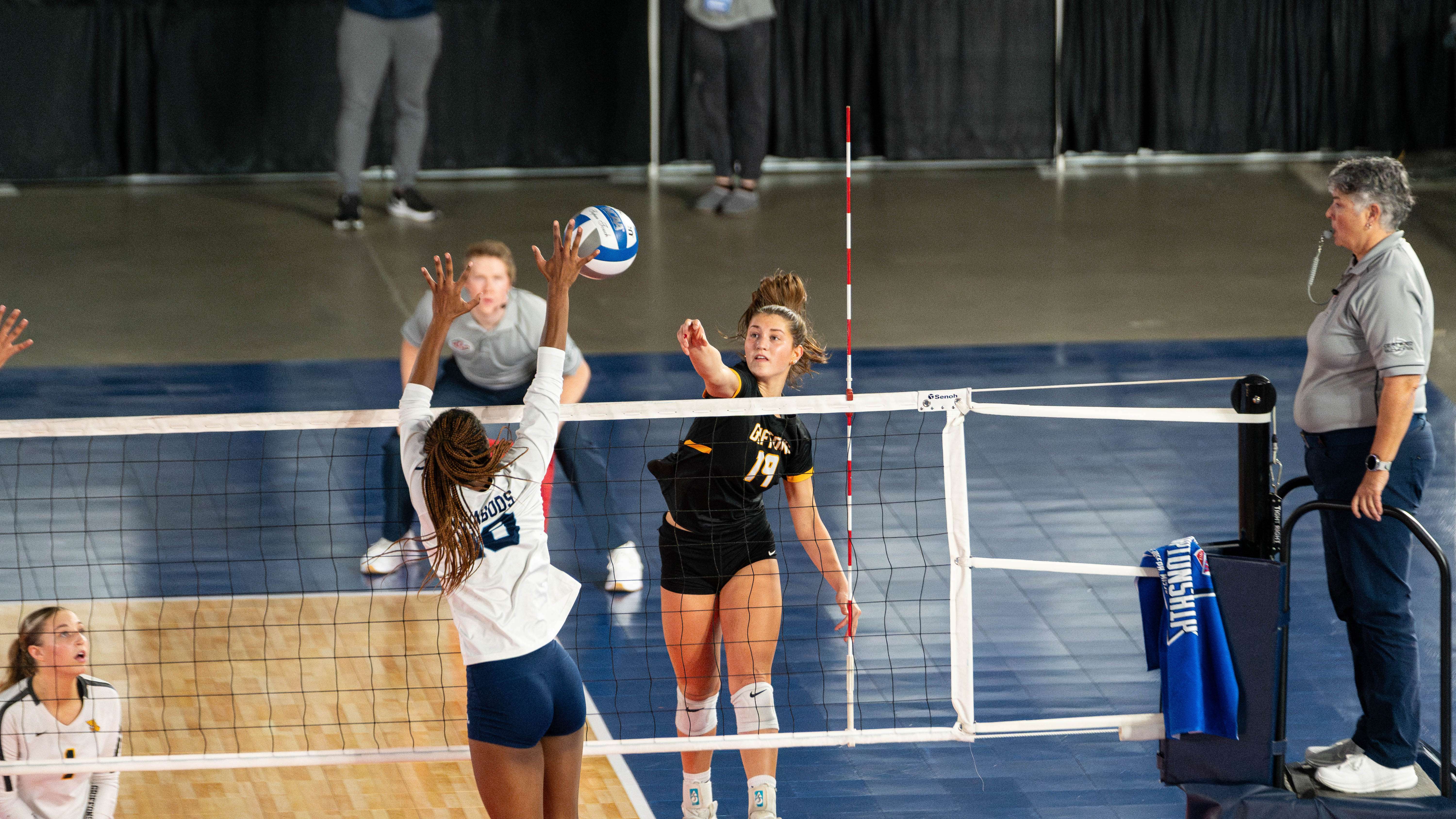 Holly Heldt (19) tries to hit a ball past a Washburn defender.