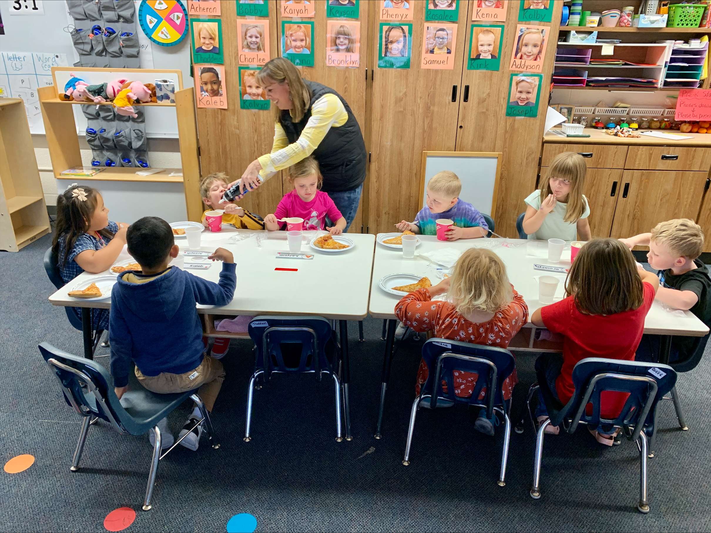 Allen Samuels CDJR Teacher of the Month Lori Tracy works with her four-year-olds on their pizza and ice cream party from Pizza Hut and Braums on Friday, Nov. 17