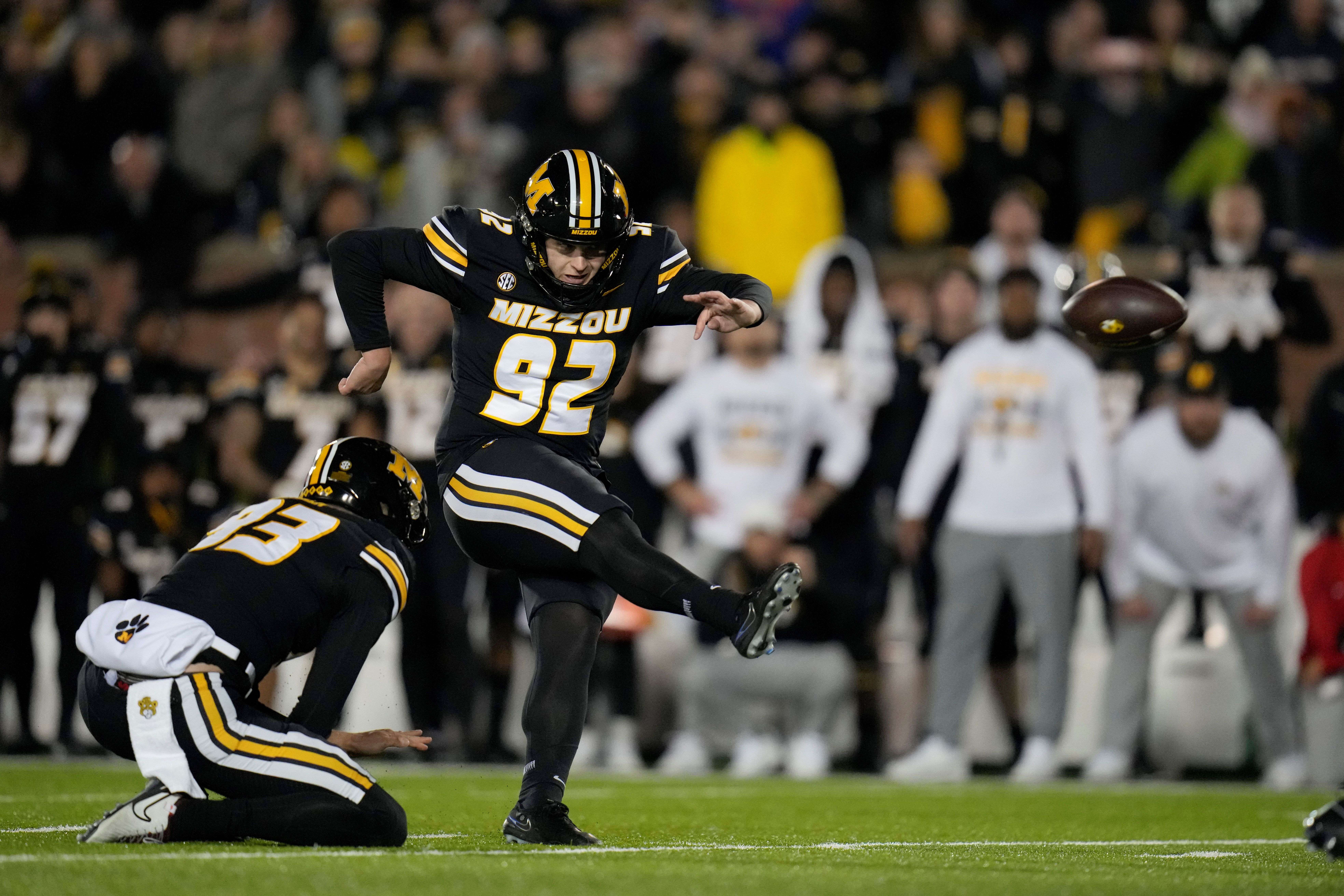 Missouri place-kicker Harrison Mevis (92) makes a 30-yard field goal with seconds left in the second half of an NCAA college football game against Florida Saturday, Nov. 18, 2023, in Columbia, Mo. Missouri won 33-31. (AP Photo/Jeff Roberson)