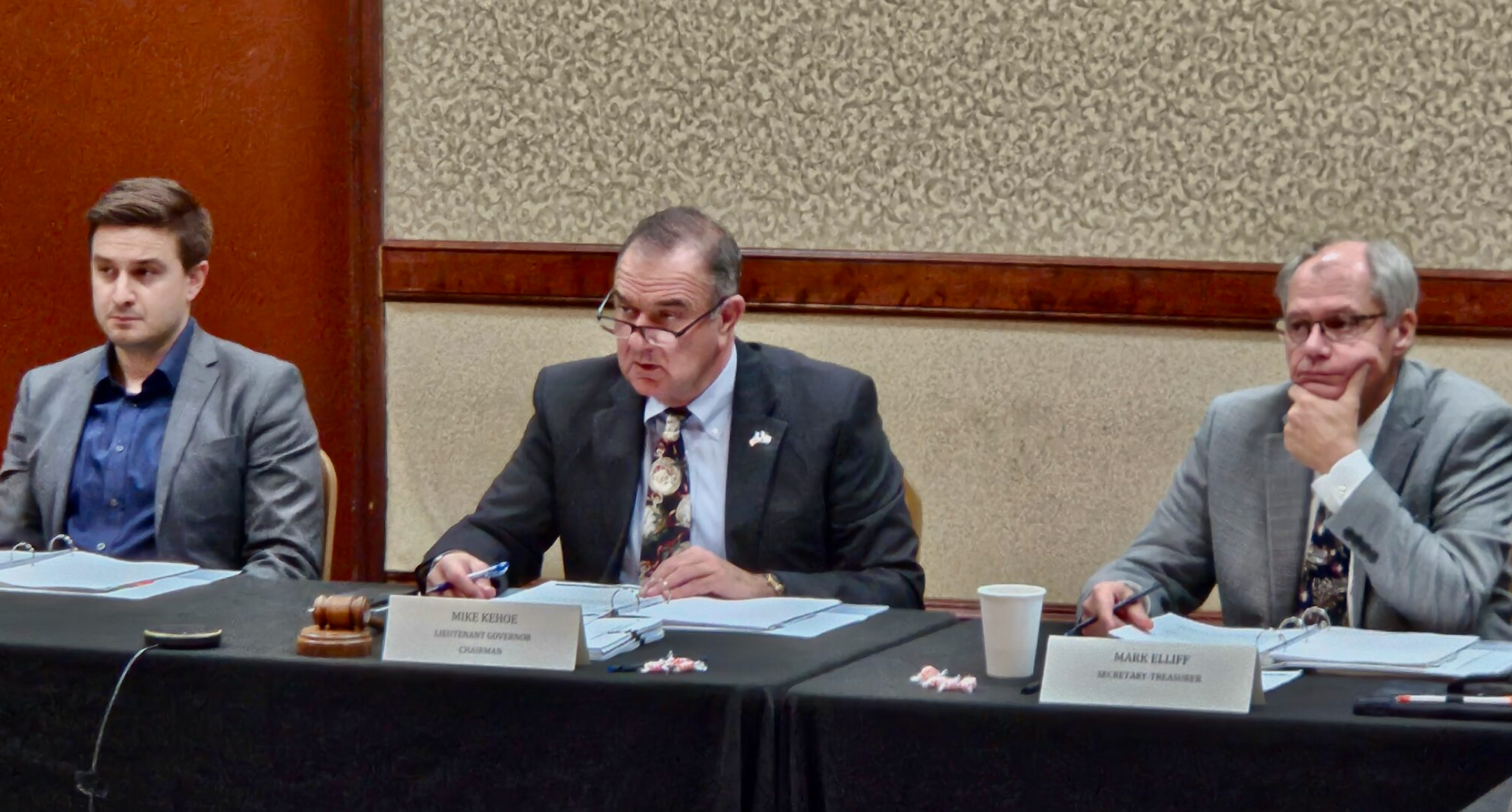  Lt. Gov. MIke Kehoe, center, speaks during Friday’s meeting of the Missouri Housing Development Commission. Kehoe is chairman of the commission. Also shown are Clayton Campbell, left, representing State Treasurer Vivek Malek, and Mark Elliff, secretary/treasurer of the commission. (Rudi Keller/Missouri Independent)