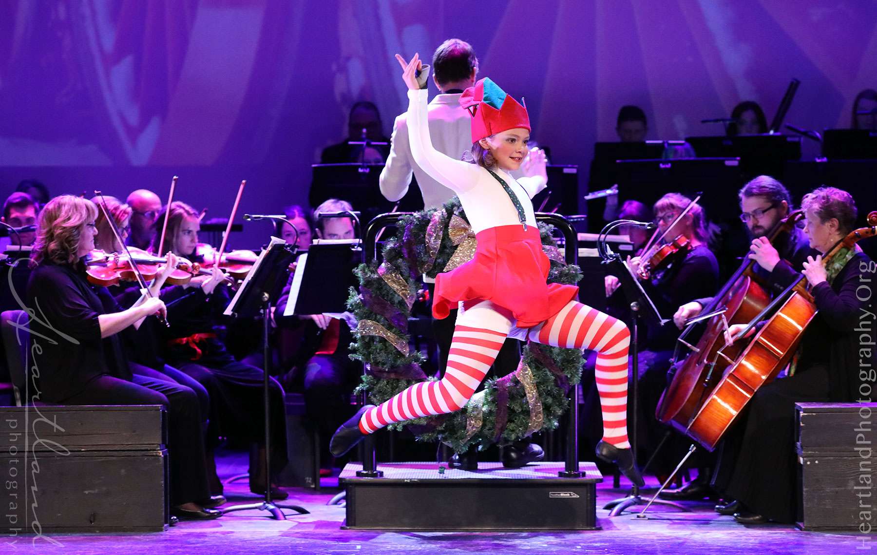 CTA dancer Paige Shaft leaps through the air while the symphony plays the Concert Suite from the Polar Express by Alan Silverstri and Glen Ballard/ arranged by Jerry Brubaker.&nbsp;<b>Images Courtesy Heartland Photography</b>