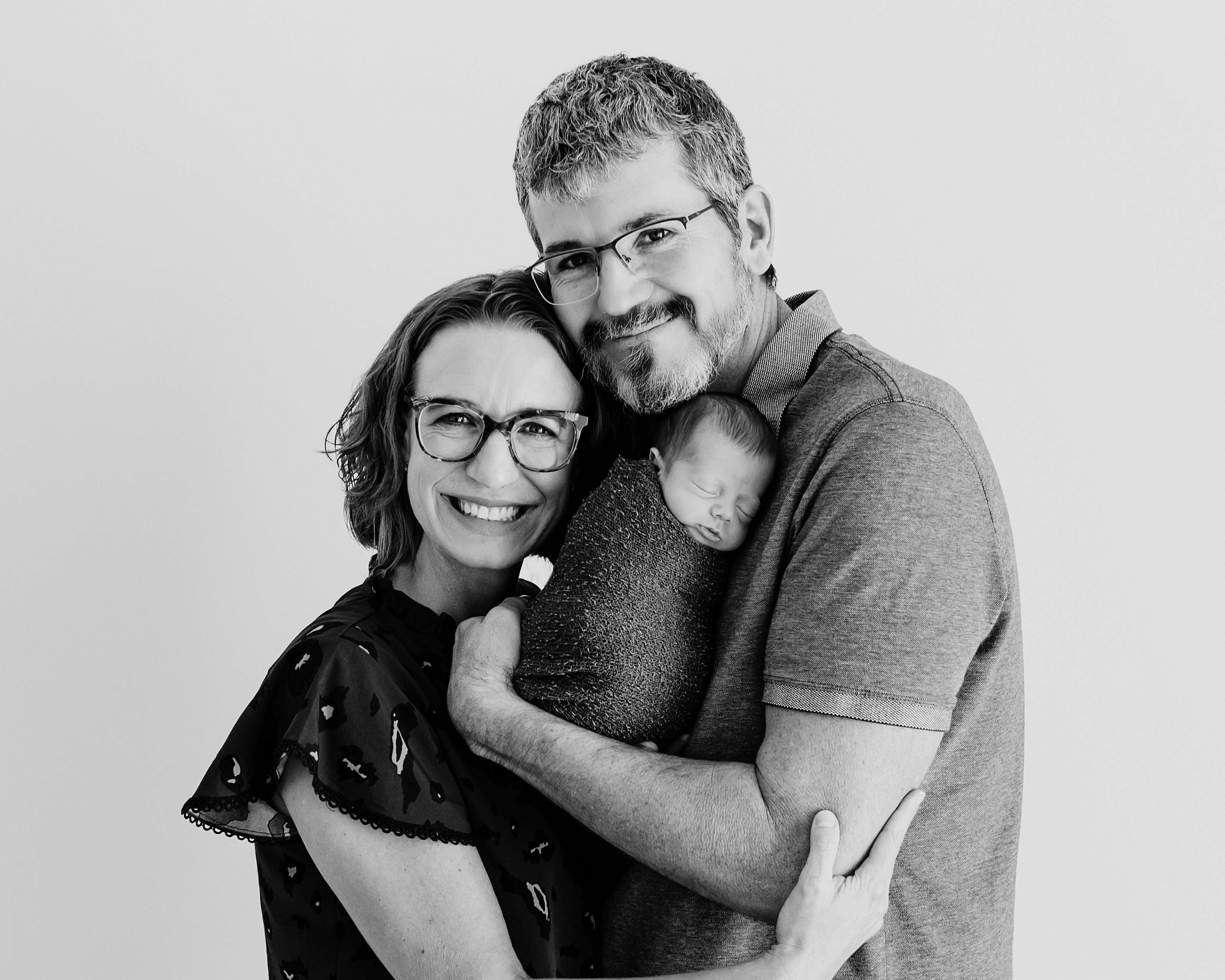 Dr. Heather Robben with her husband, John Benkelman, and their newborn. Submitted