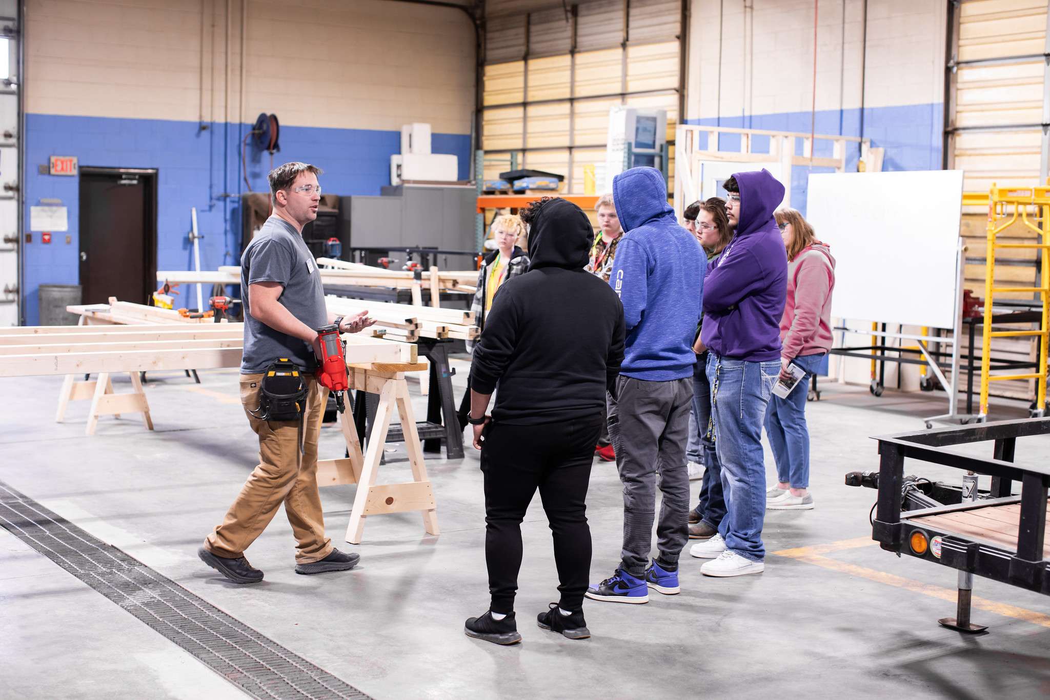 Carpentry instructor Matt Mazouch explains how to use certain tools during the Carpentry session at Junior Day on the Barton Campus Wednesday.