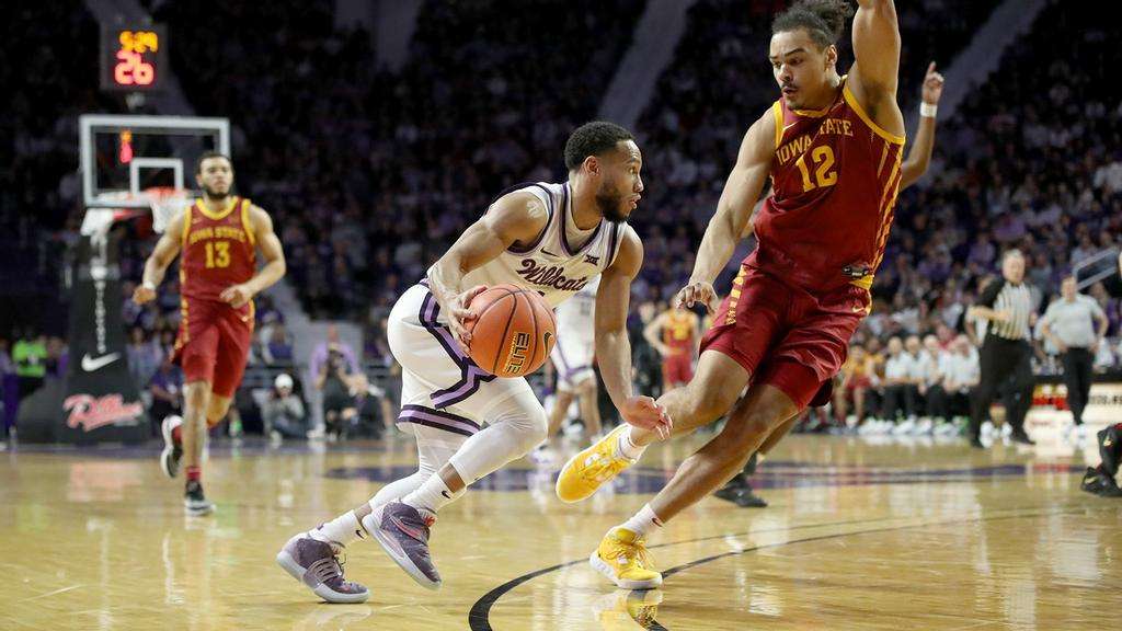 Kansas State guard Markquis Nowell drives against Iowa State's Robert Jones (12) in a Big 12 basketball game February 18, 2023 in Manhattan, Kan. (Kansas State Athletics photo)