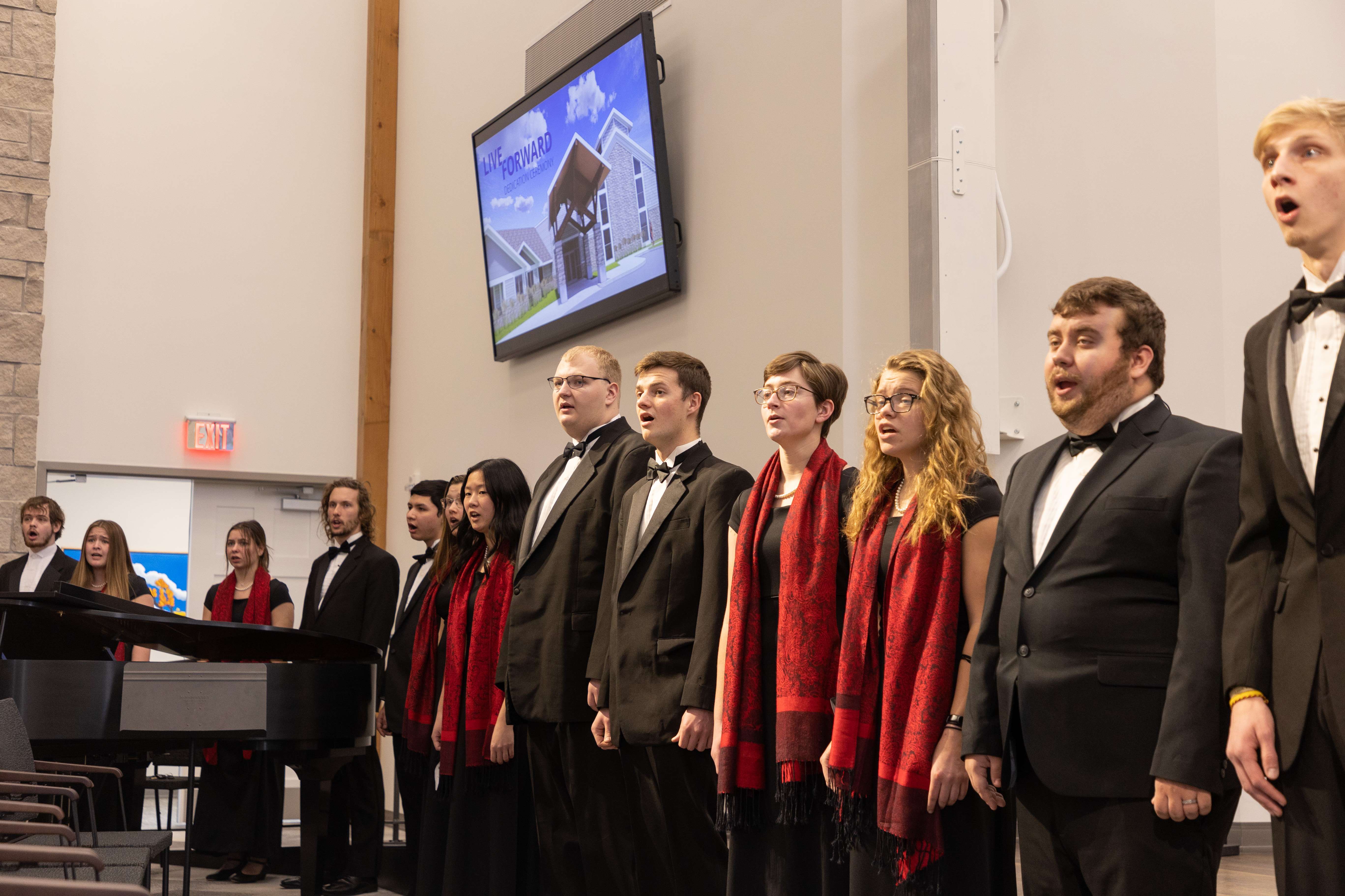 <i>The Bethel College Concert Choir, under the direction of Dr. Henry Waters, offer a song of blessing during the Live Forward dedication ceremony. [Photo by Hutton Construction.]</i>