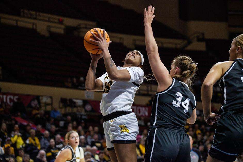 Connie Clarke (left) had 23 points and 14 rebounds to lead Missouri Western in a 71-62 loss to Fort Hays State in MIAA tournament quarterfinals in Kansas City Friday. Photo by Arianne Boma.