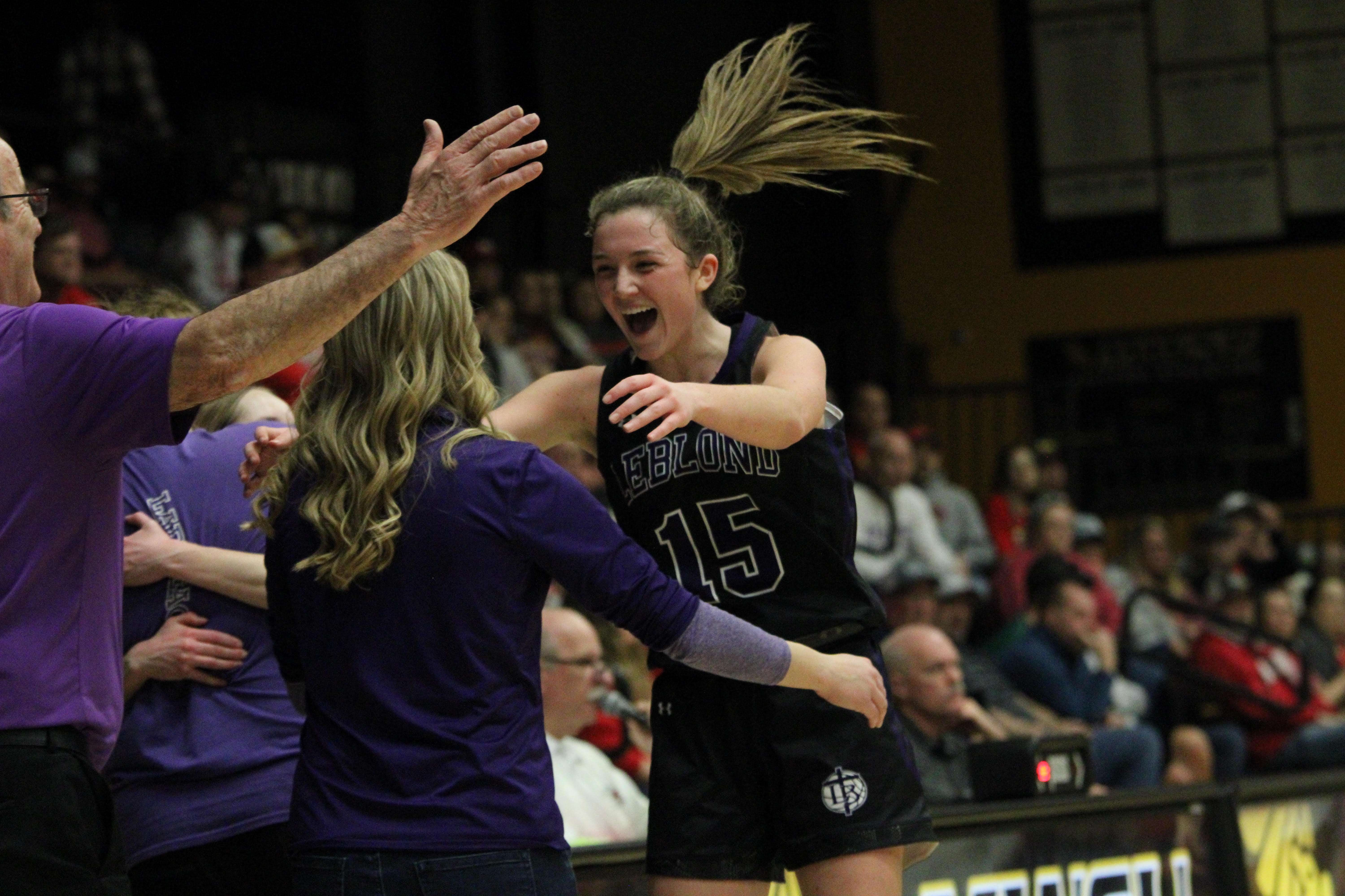 LeBlond's Kaleigh Ziesel embraces LeBlond coach Jackie Steltenpohl during the Eagles' state quarterfinal win over Miller at the MWSU Fieldhouse Saturday. Photo by Clifton Grooms.