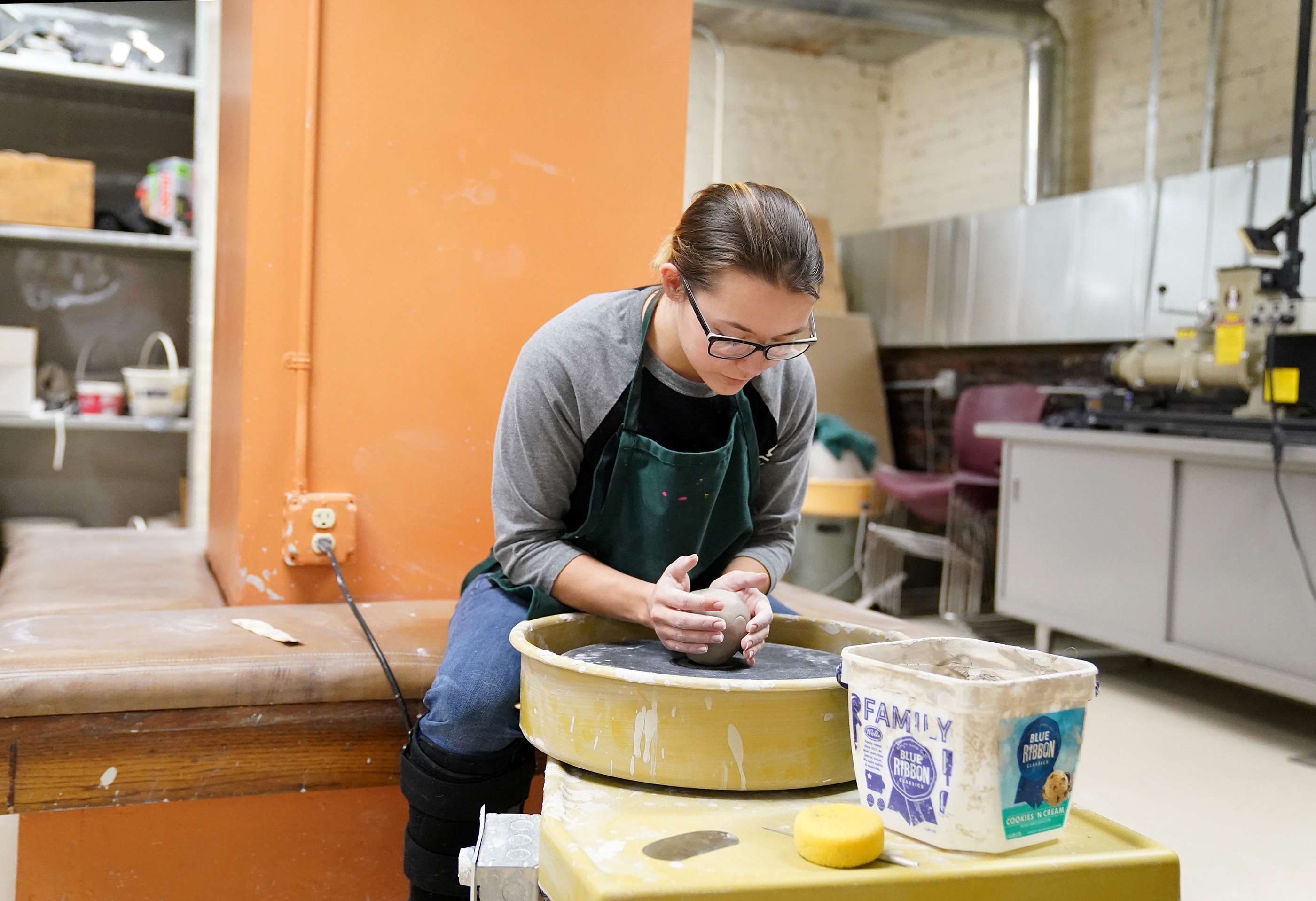 North Platte Community College student Hailey Myers, of Arnold, throws a pot as part of a ceramics class at the Prairie Arts Center. The work of NPCC art students will be on display at the arts center throughout April.