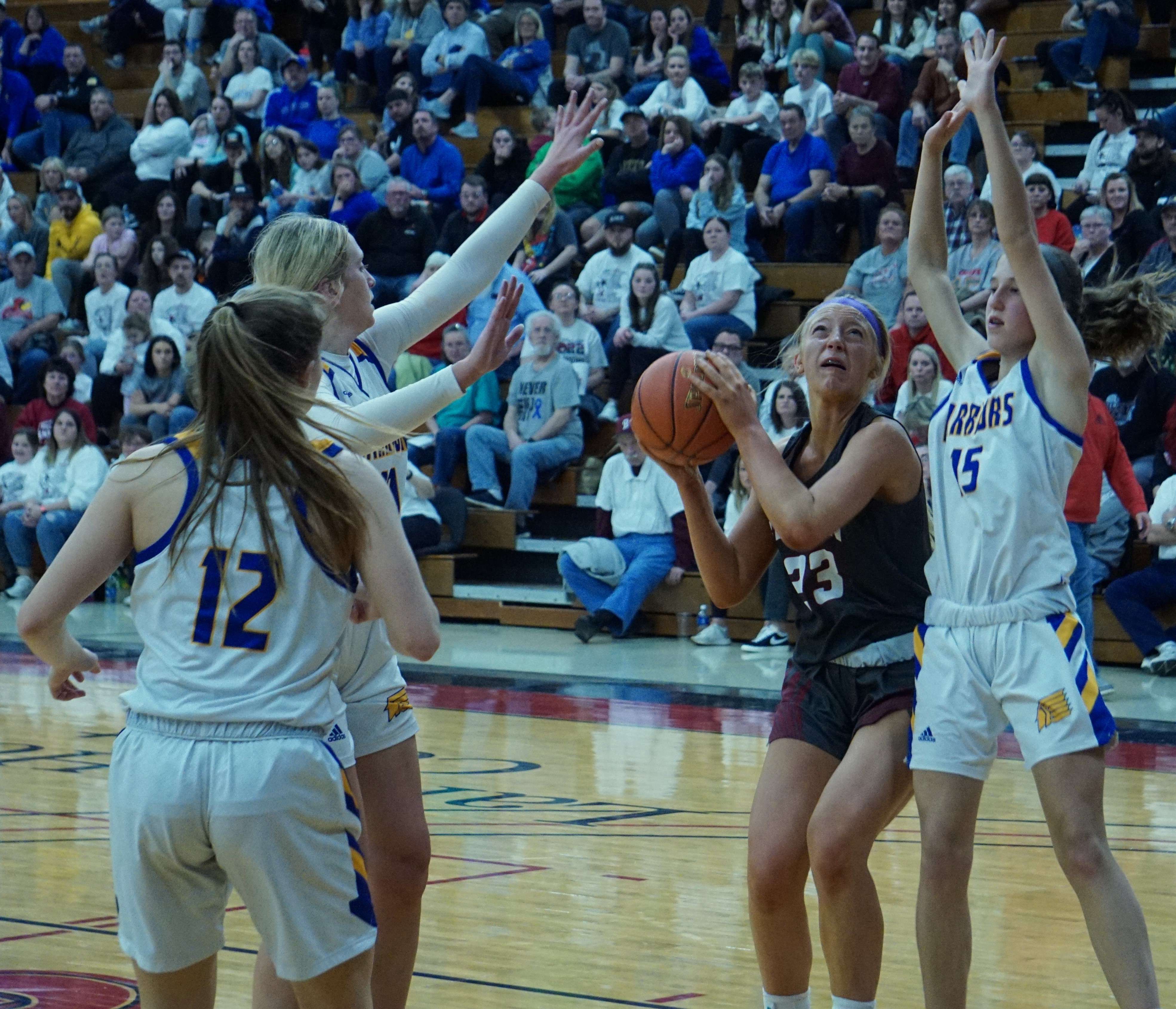 Andrea Simmons (23) tries to go up for a layup in the second half.