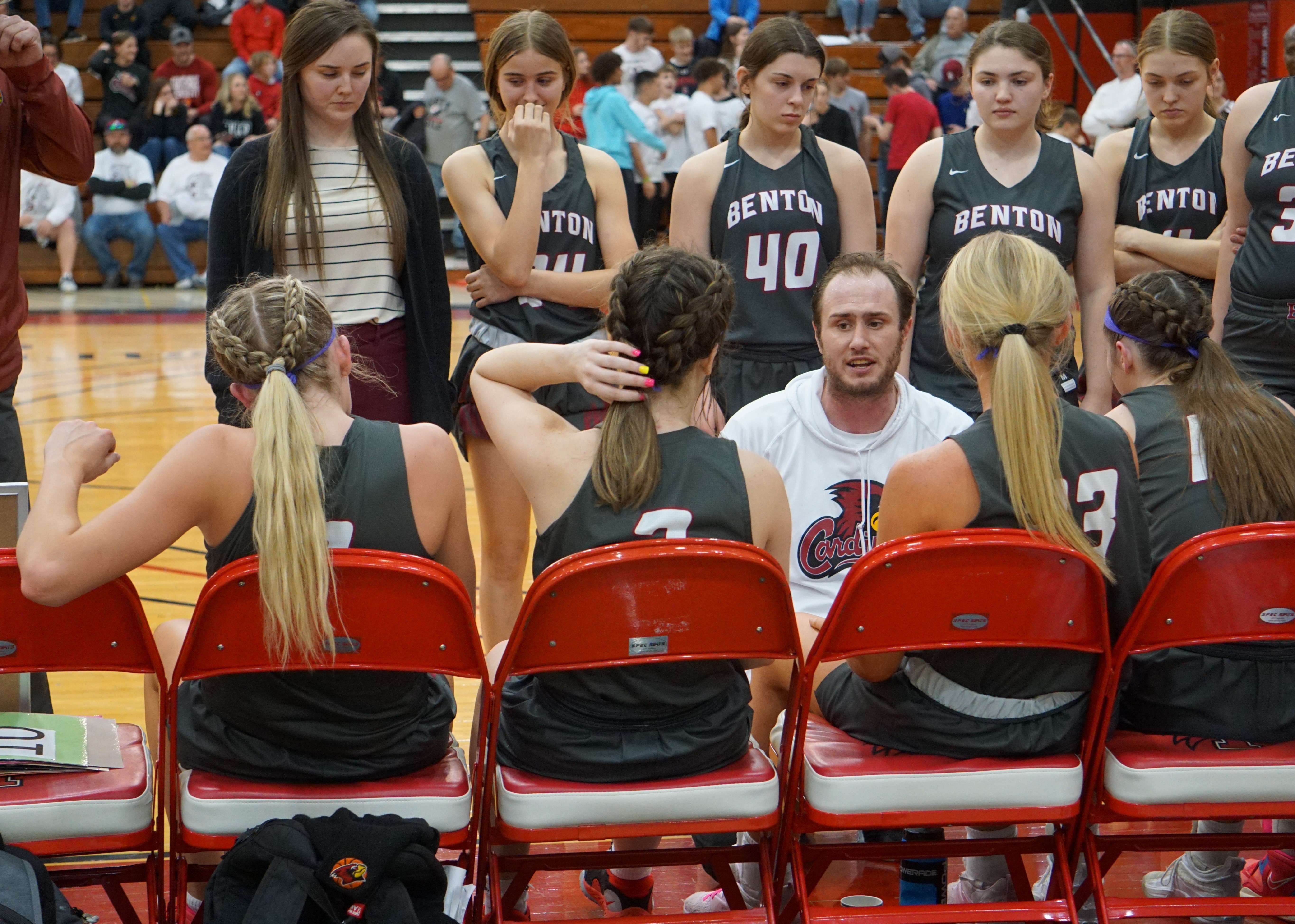 Benton coach Chris Michaels addresses the team during a timeout.