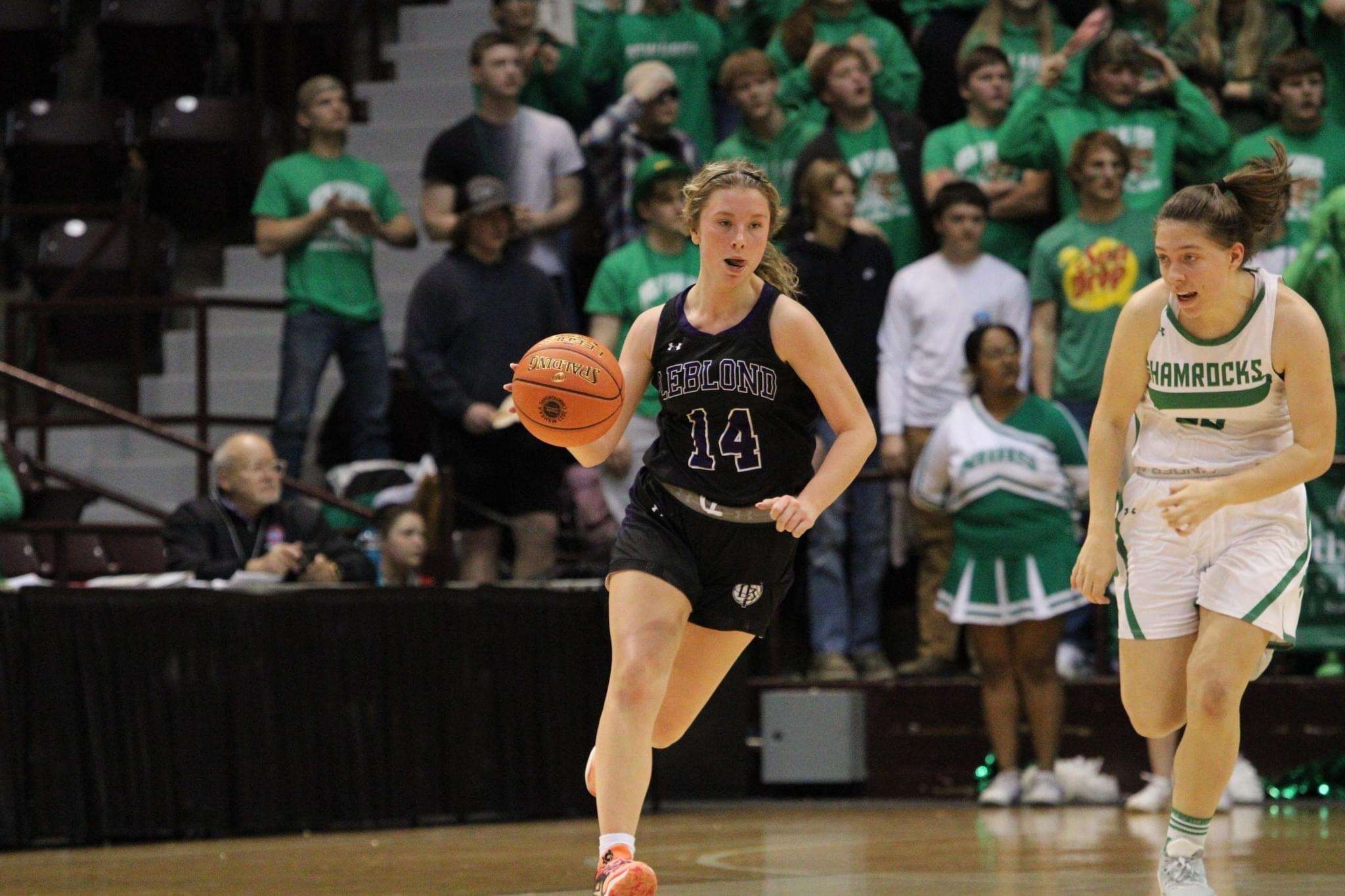 Bishop LeBlond's Tatum Studer (14) brings the ball up the floor during the Golden Eagles' Class 2 state semifinal against New Haven Friday. Photo by Clifton Grooms.