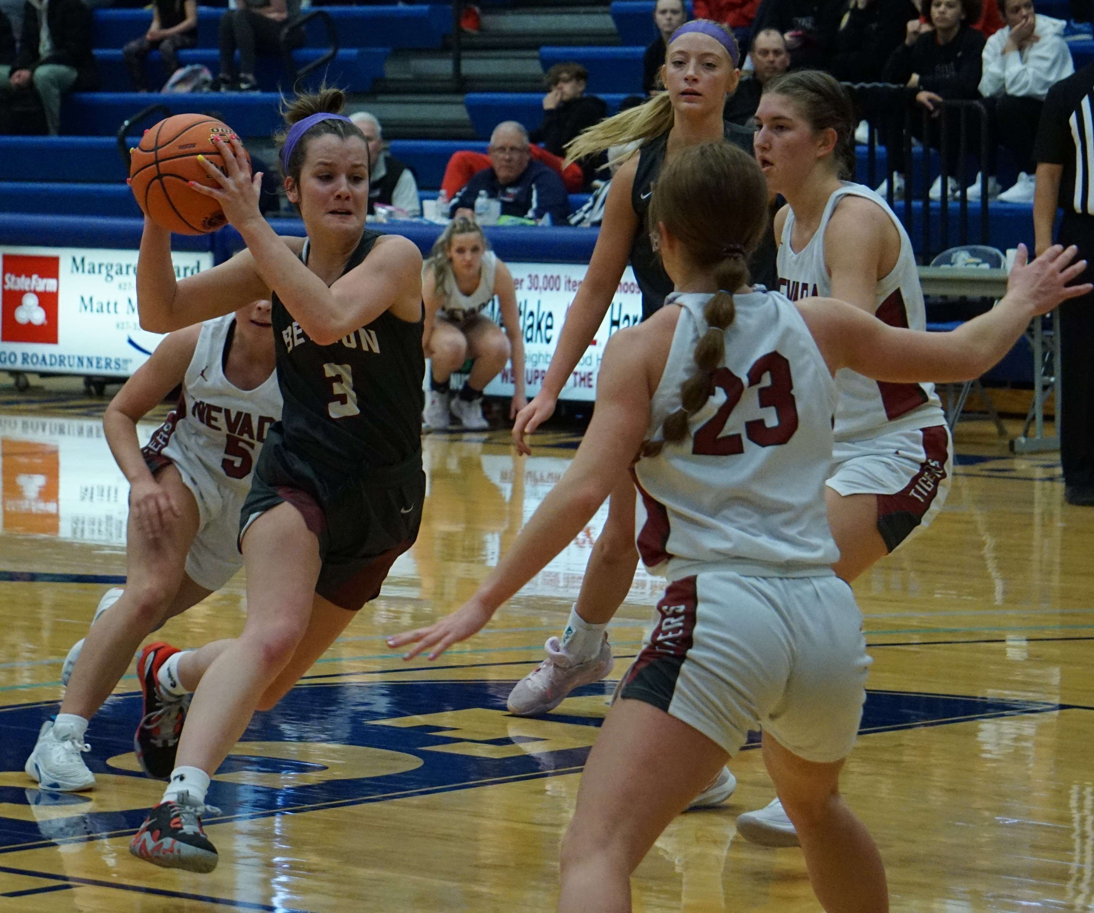 Benton's Avery Morlock (3) drives the lane in the first half of the Cardinals' Class 4 state quarterfinal game against Nevada at State Fair Community College in Sedalia Saturday. Photo by Tommy Rezac.