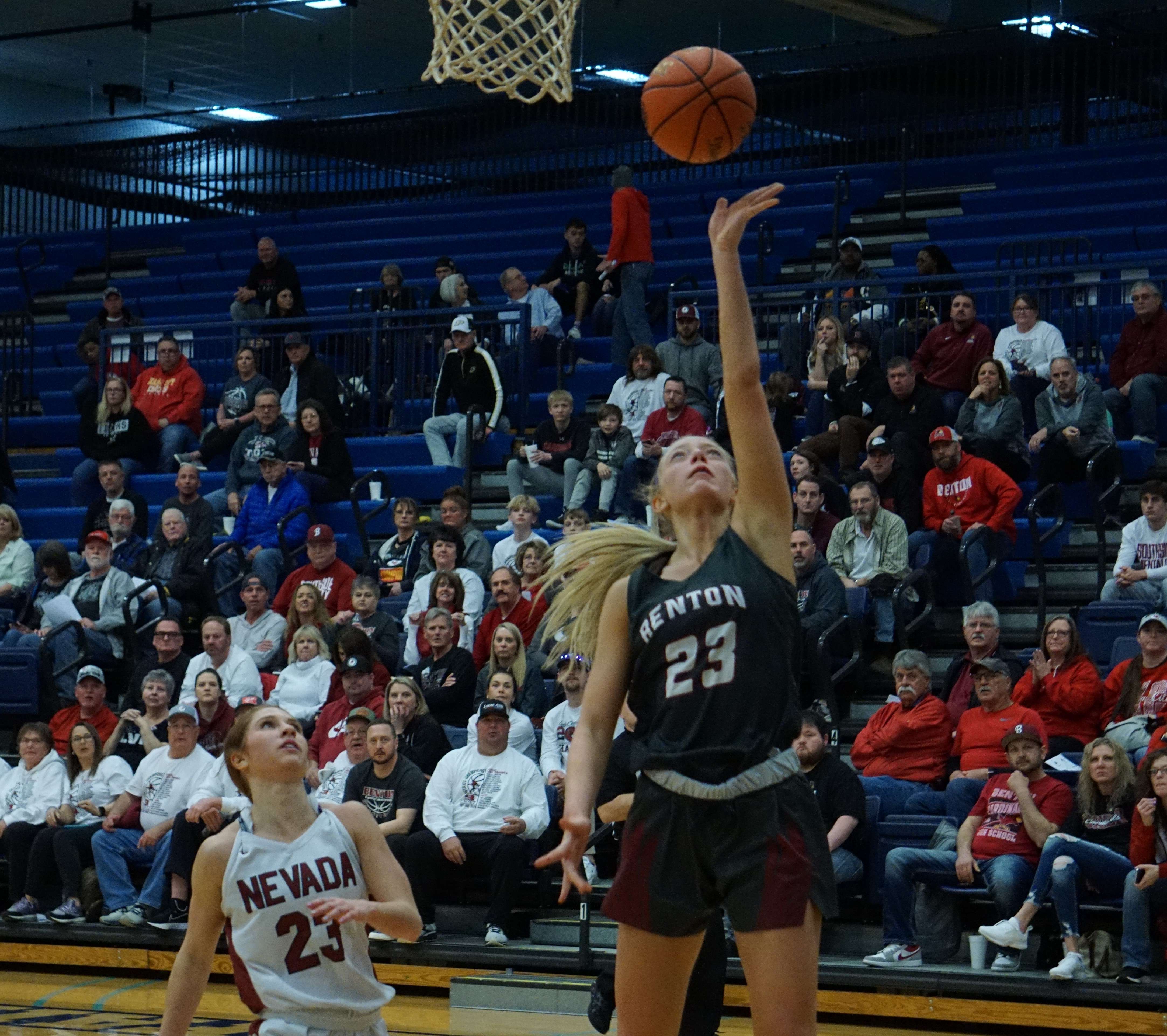 Andrea Simmons (23) puts up a layup.