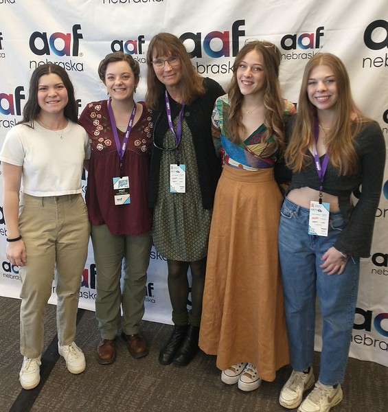 Chadron State College students pose at Meet the Pros in Omaha March 1, 2023, with Art Professor Mary Donahue. From left, Allison Acosta, Abigail Swanson, Sidney Brown and Sam Rozmiarek. (Courtesy photo, used with permission)