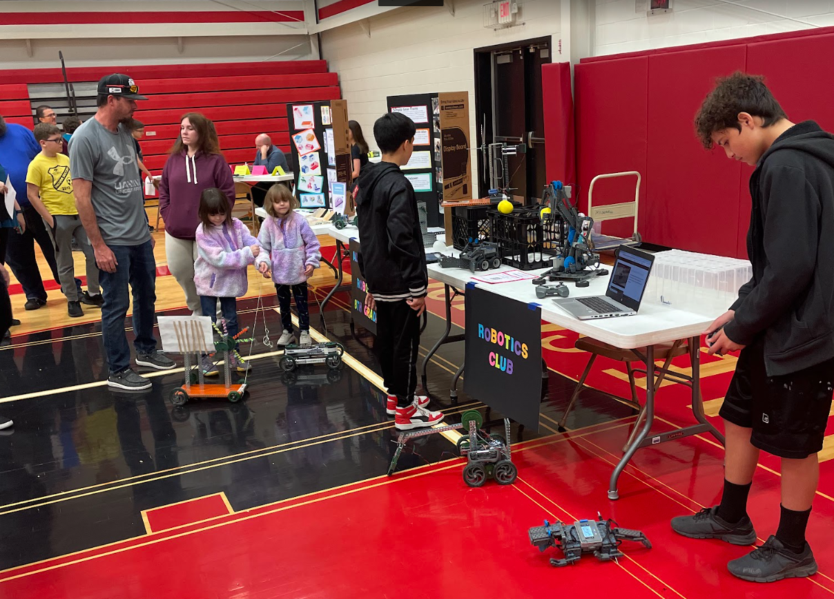 Captured at the 2022 Spring Expo, GBMS students share a robotics demonstration with future Panthers.