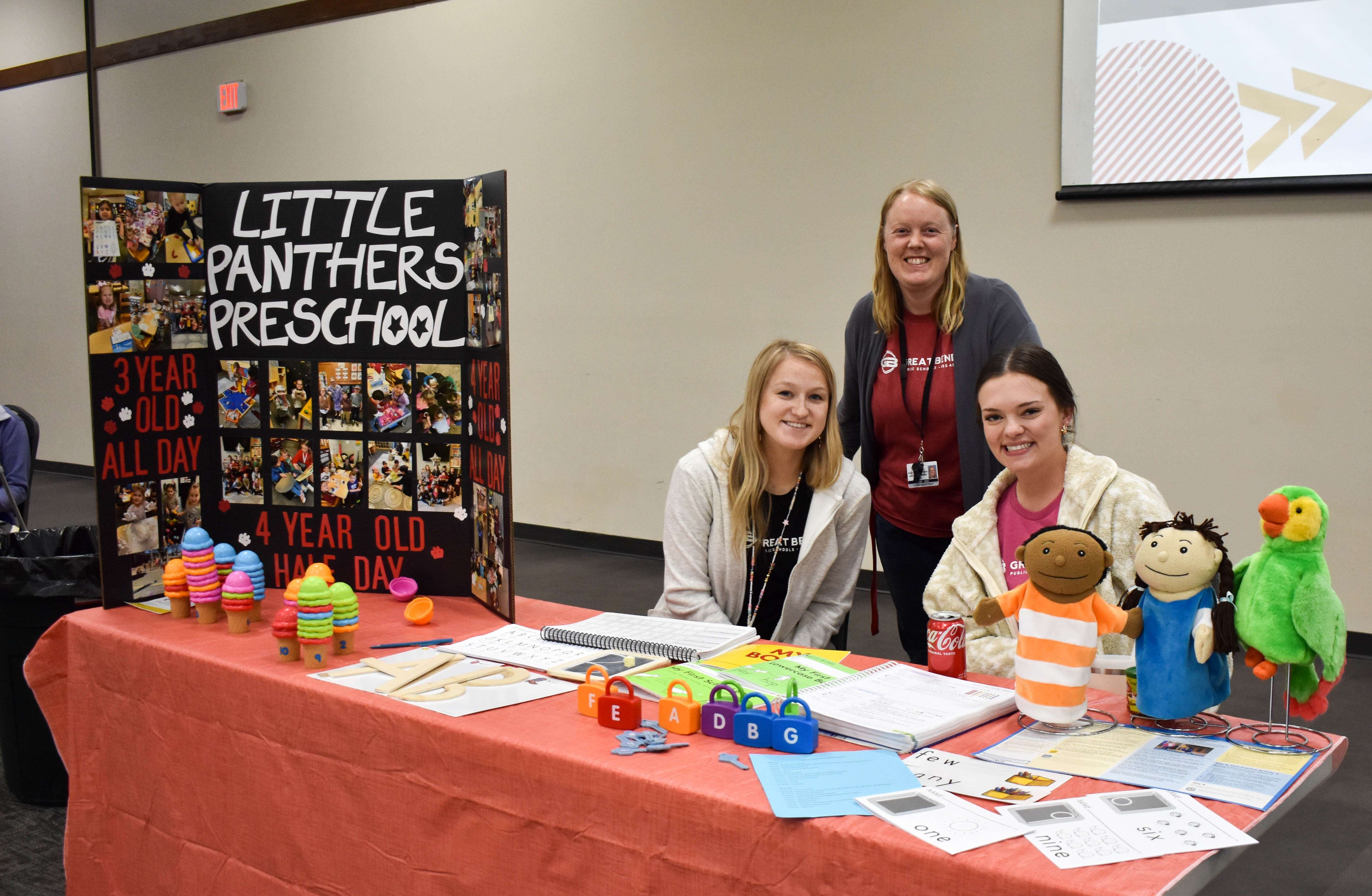 Staff from USD 428's Little Panthers Preschool welcome visitors at the 2022 Pre-Enrollment Fair. Pictured left to right: Kimberlyn Rivas, teacher; Amanda Moran-Jones, coordinator; Brooklyn Burkhart, teacher.