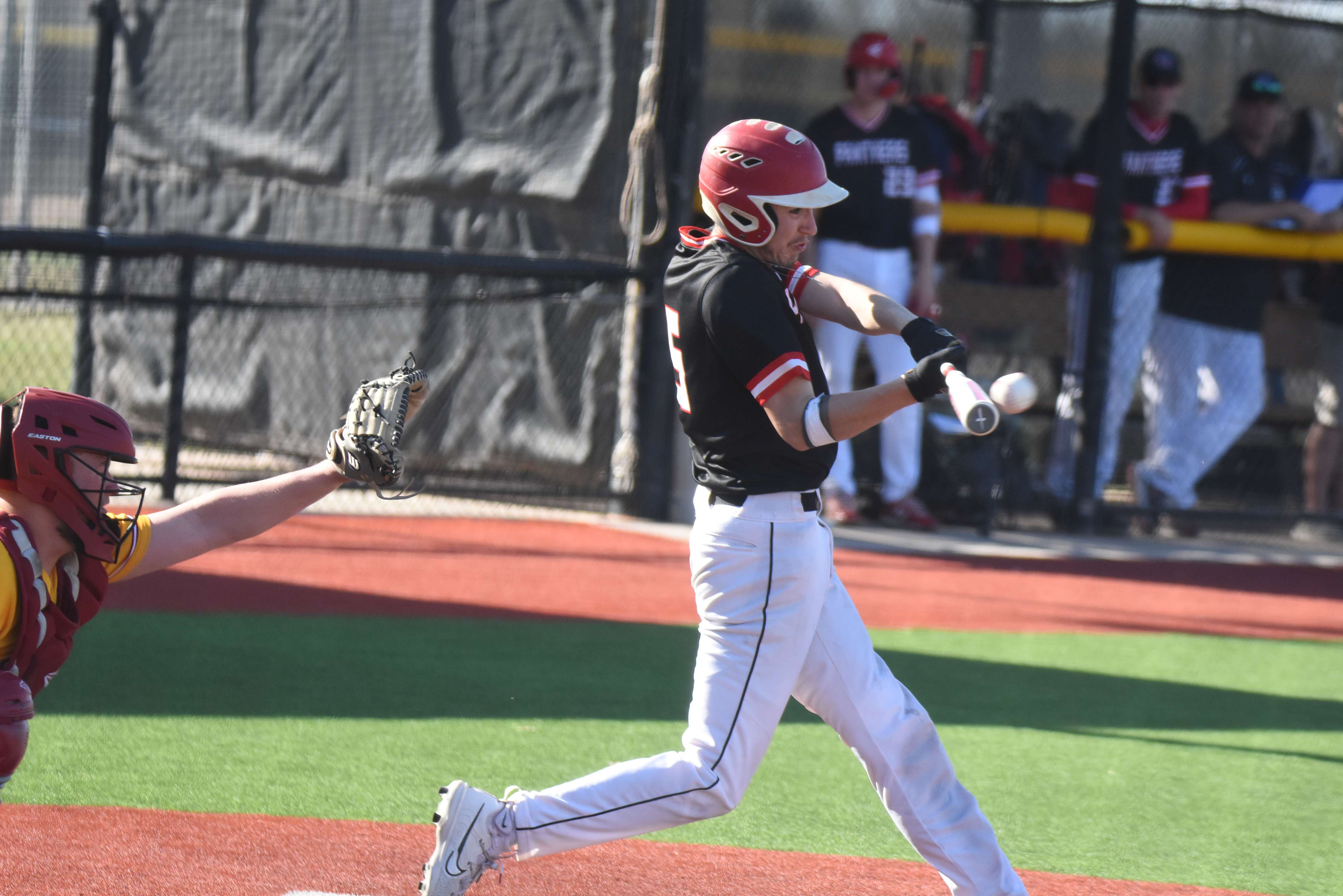 Panther senior Edwin Chavez delivers a 2-run single in the sixth inning to help Great Bend to a 5-4 game-one win against Hays. The Indians took game two 5-4.
