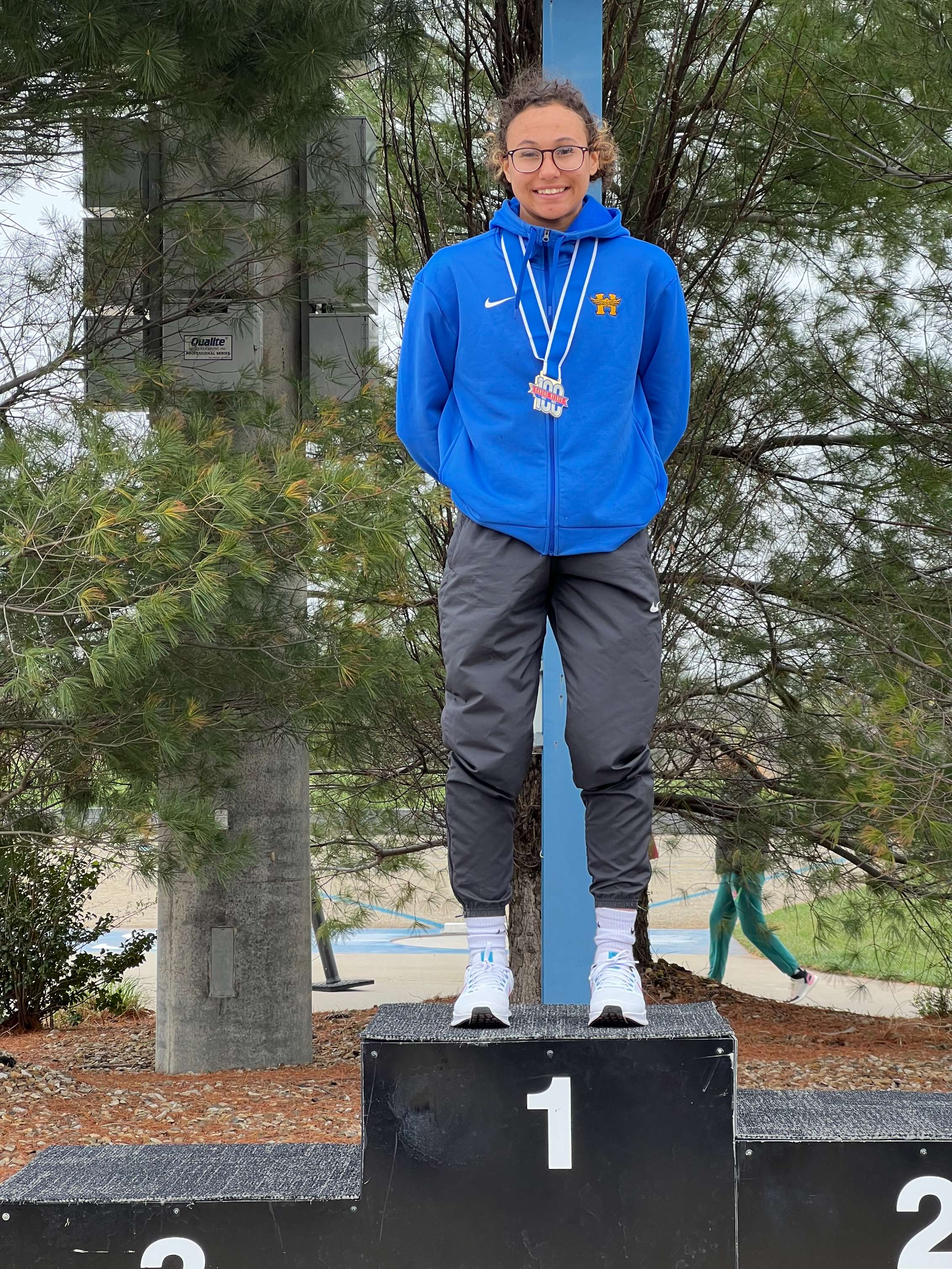 AnnaLisa Cullens, 100m hurdles champion, 300m 3rd place at Kansas Relays. Photo by Tina Johnson.
