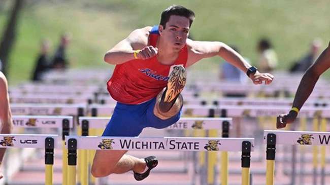 Alexander Holt wins the Bethel Invitational 110-hurdles on Saturday in Newton. (Andrew Carpenter/Blue Dragon Sports Information)
