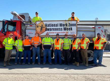 KDOT employees in Concordia wear orange and yellow safety colors to show their support for all highway workers across Kansas during National Work Zone Awareness Week. Photo from Kansas Department of Transportation