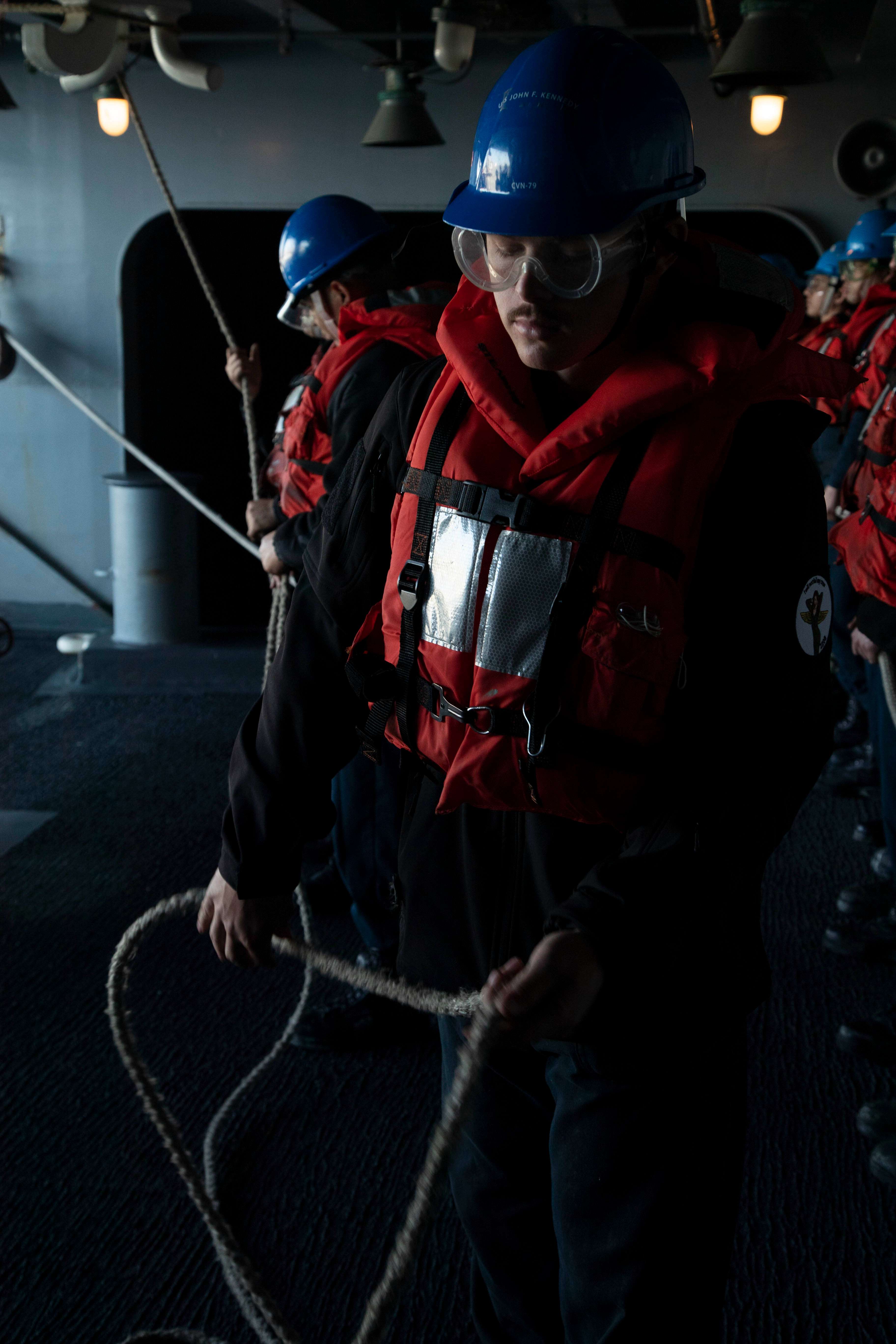Boatswain’s Mate 3rd Class Colin Hall, from Great Bend, assigned to the aircraft carrier USS Gerald R. Ford’s (CVN 78) deck department, feeds an unrep line to the receiver aboard USNS Leroy Grumman (T-AO 195) during a refueling-at-sea evolution, May 2, 2023. Hall graduated from Great Bend High School in 2020. Gerald R. Ford is the flagship of the Gerald R. Ford Carrier Strike Group. As the first-in-class ship of Ford-class aircraft carriers, CVN 78 represents a generational leap in the U.S. Navy’s capacity to project power on a global scale. (U.S. Navy photo by Mass Communication Specialist 2nd Class Brian T. Glunt)