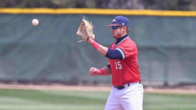 Ryan Henderson hits his career 20th home run in Game 1 and drives in four runs in an 8-3 victory in Game 2 over Colby on Thursday afternoon to lead the Blue Dragon baseball team. (Andrew Carpenter/Blue Dragon Sports Information)<br>