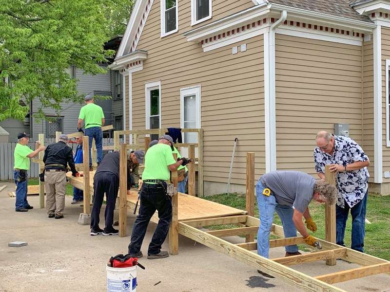 <b>AMBUCS members work on the ramp at Ashby House Friday morning.</b> Photo by Leslie Eikleberry/Salina Post