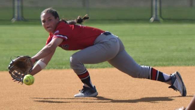Madison Grimes makes a diving stop in the hole in the first inning of Saturday's Region VI Tournament game vs. Butler. (Steve Carpenter/Blue Dragon Sports Information)<br>