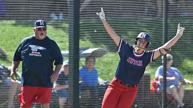 Alexis Mastin and first-base coach Ray Aguirre react after her home run in the first inning of Hutchinson's 6-4 win over Colby in the Region VI Tournament losers' bracket final on Sunday in Dodge City. (Andrew Carpenter/Blue Dragon Sports Information)<br>