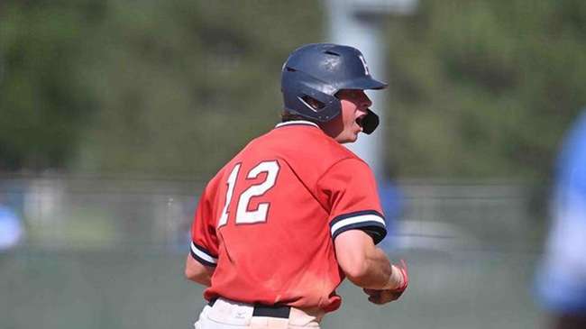 Will Edmunson reacts to his game-tying two-run home run in the eighth inning of Game 2, an 8-7 Blue Dragon win over Colby, on Saturday at Hobart-Detter Field. (Andrew Carpenter/Blue Dragons Sports Information)<br>