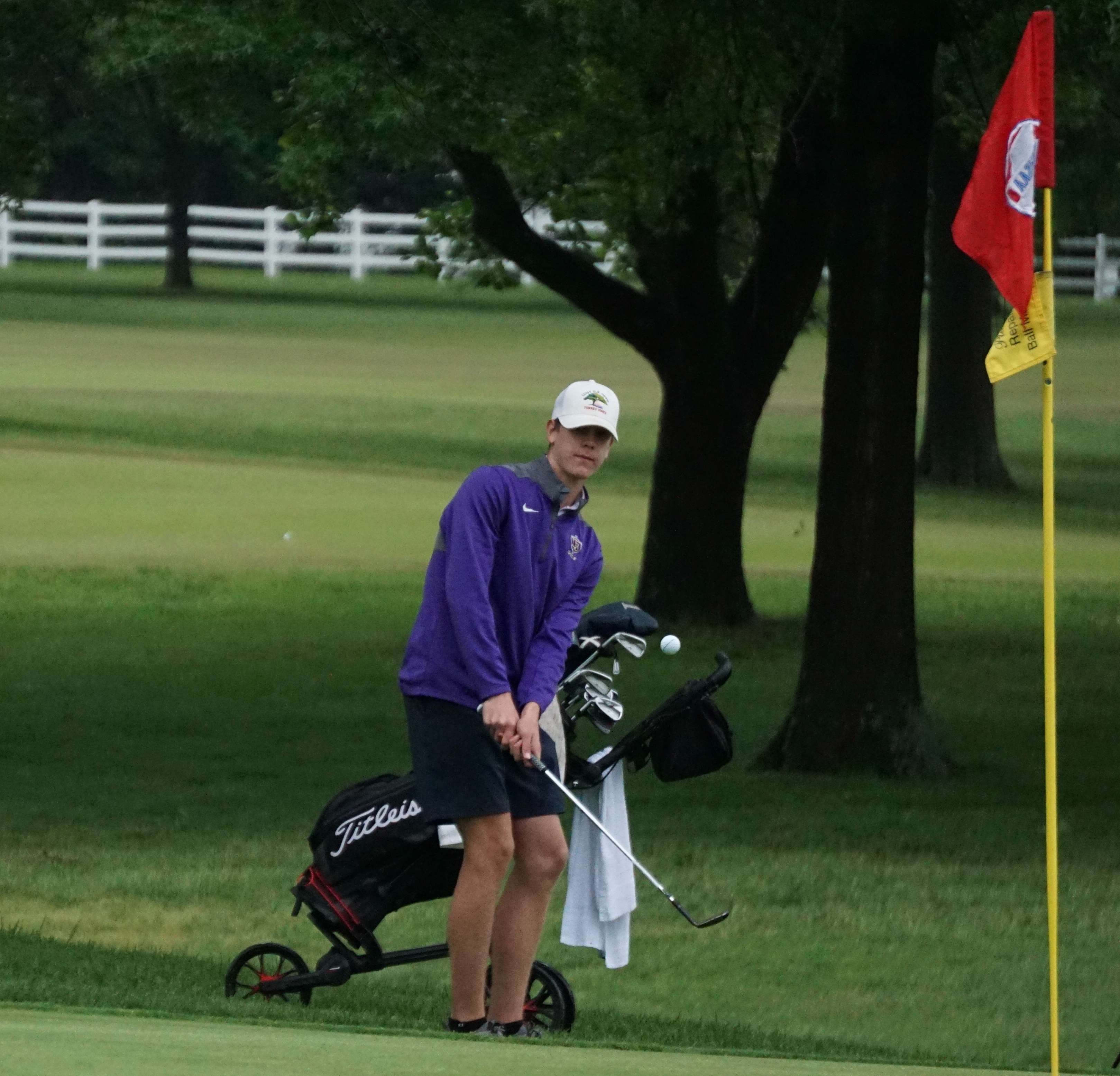 Pat Johnston chips onto the green.