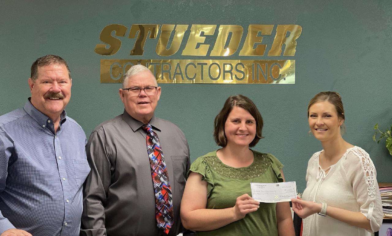 Stueder Contractors presents $1,000 check in sponsorship of the 2023 program. Pictured L to R – Terry Stueder, owner of Stueder Contractors, Rusty Wrinkle, Community Liaison for the Core Community Program, Rachel Ellson, Core Community Coach and Tarynn Stueder Kirmer, Stueders Customer Service & Client Billing Associate.