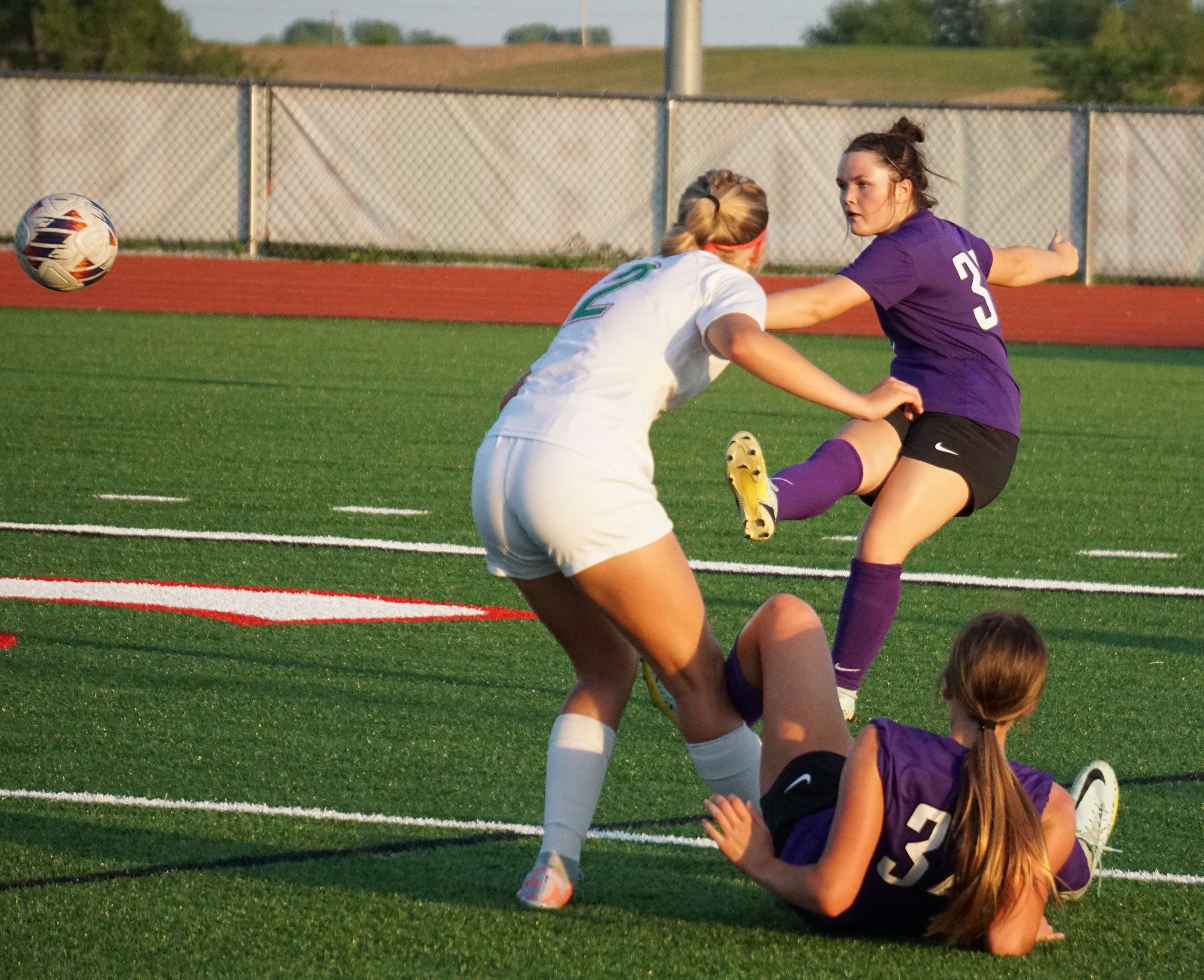 Emersyn Lenz kicks the ball away.