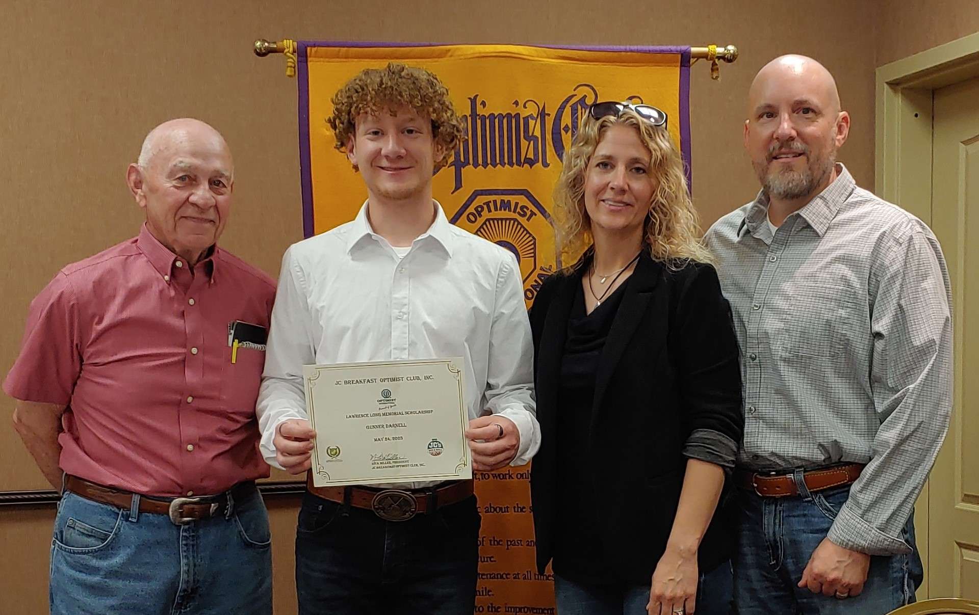 Pictured left to right: Lonnie Clark, Gunner’s grandfather and JC Breakfast Optimist Club member; Gunner Darnell; Courtney and Travis Darnell, Gunner’s parents.