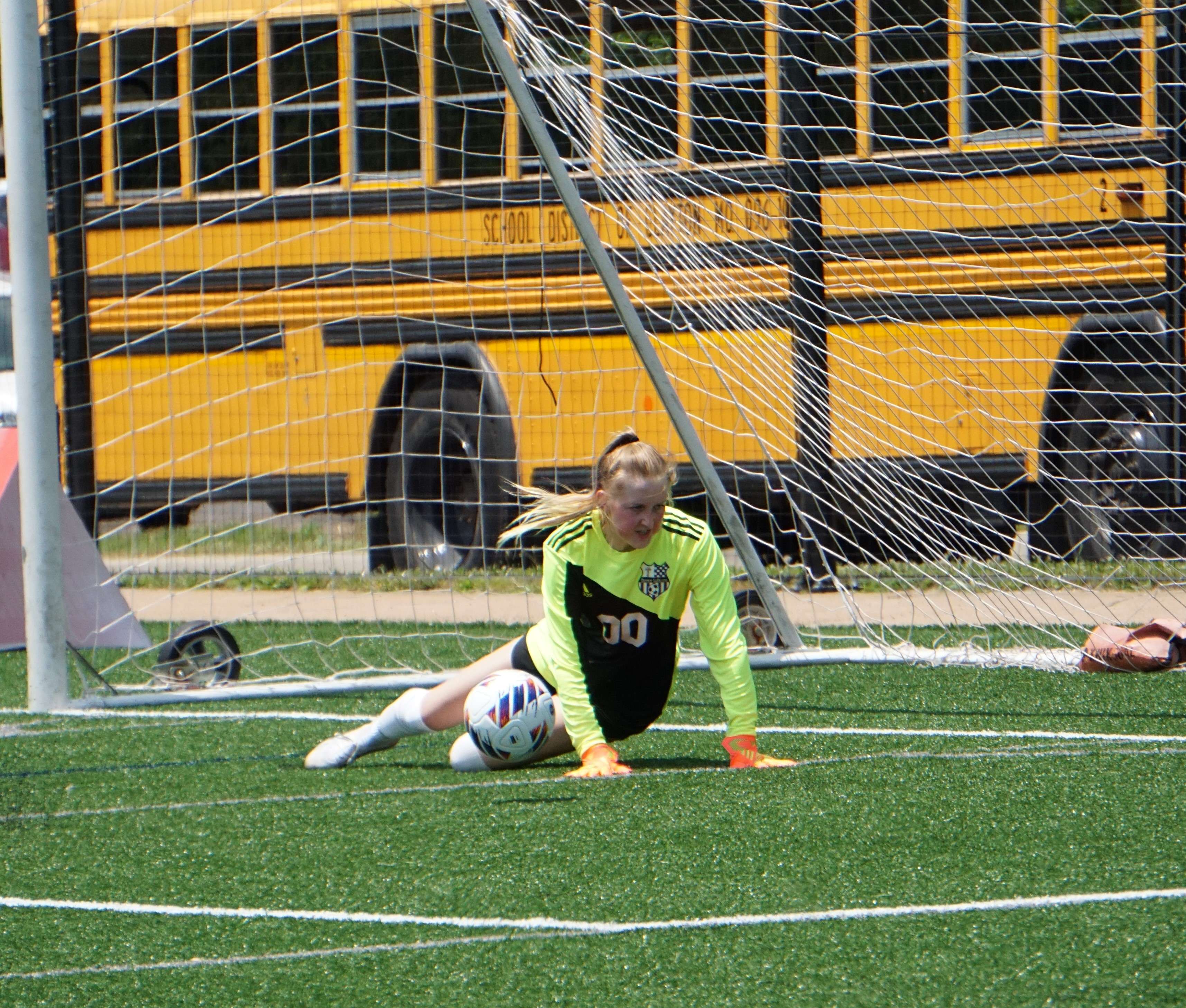 Bishop LeBlond goalie Maddie Sego dives to make a save in the second half. Photo by Tommy Rezac.